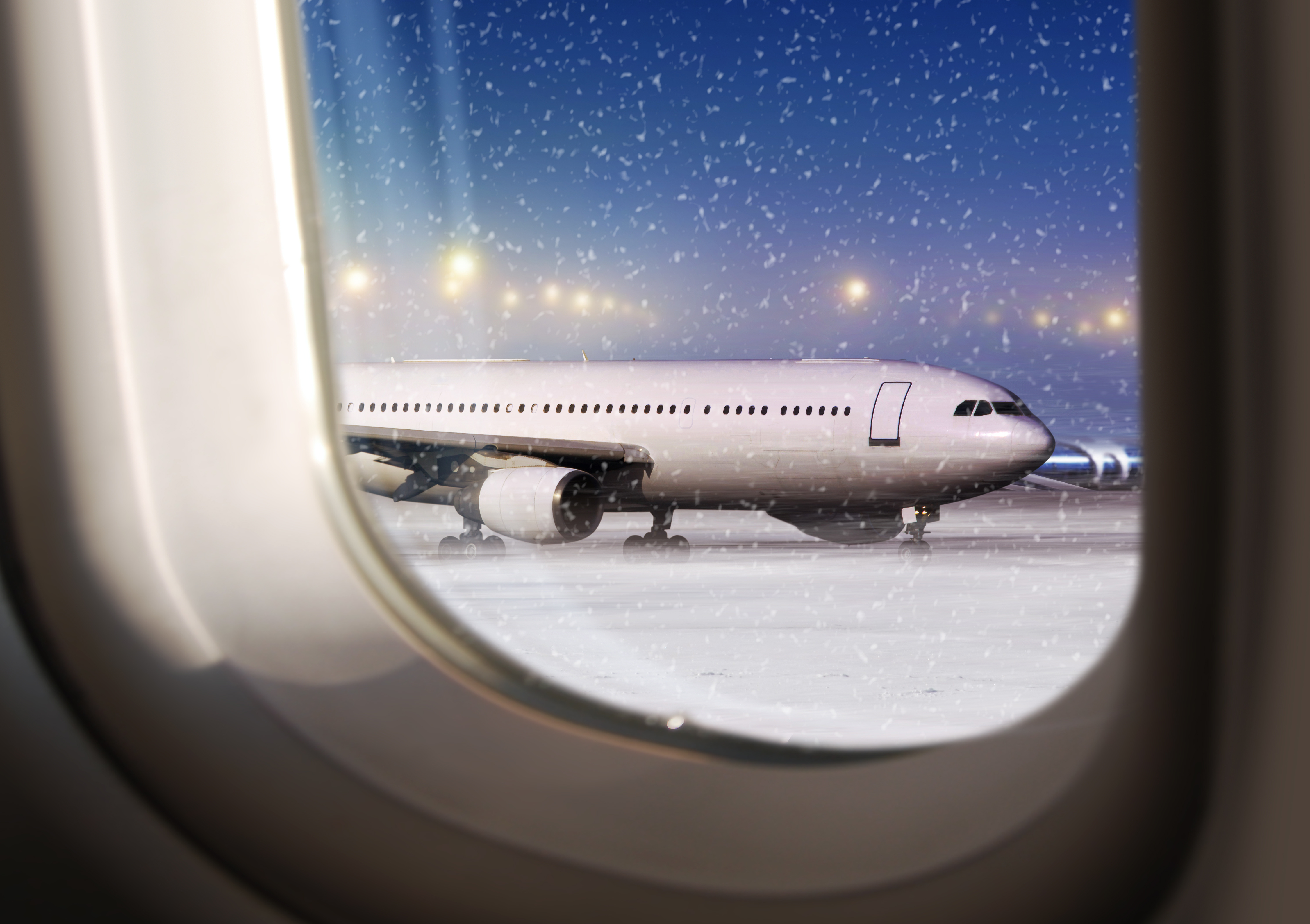 View of snowfall through plane window