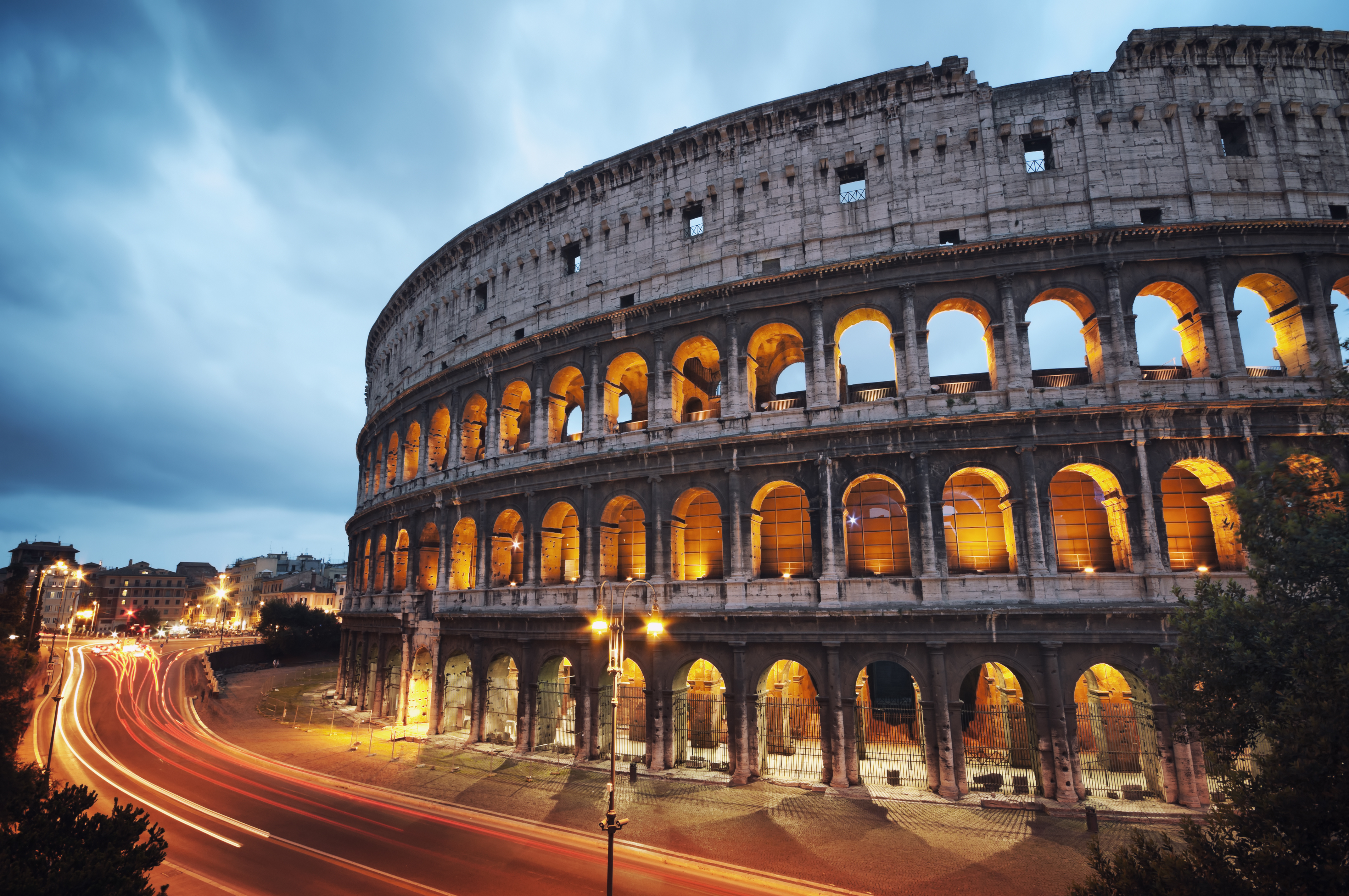 Roman Colosseum lit up in evening