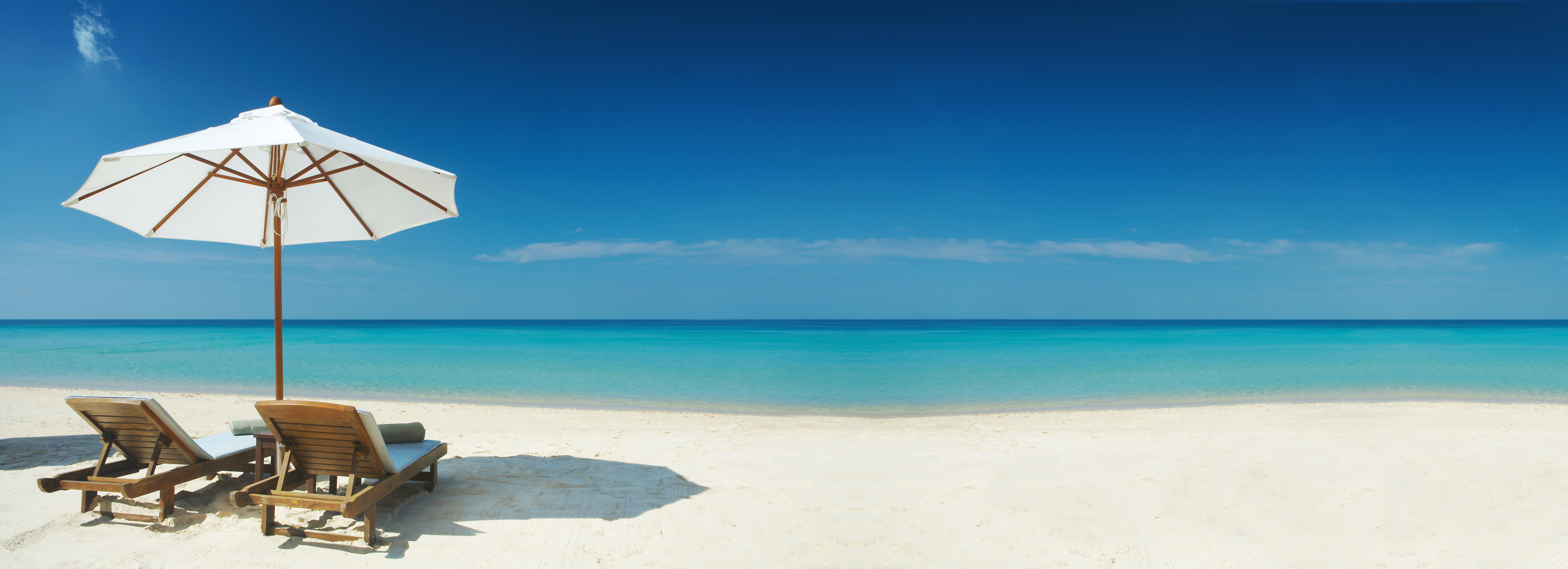 Lounge chairs and umbrella on beach