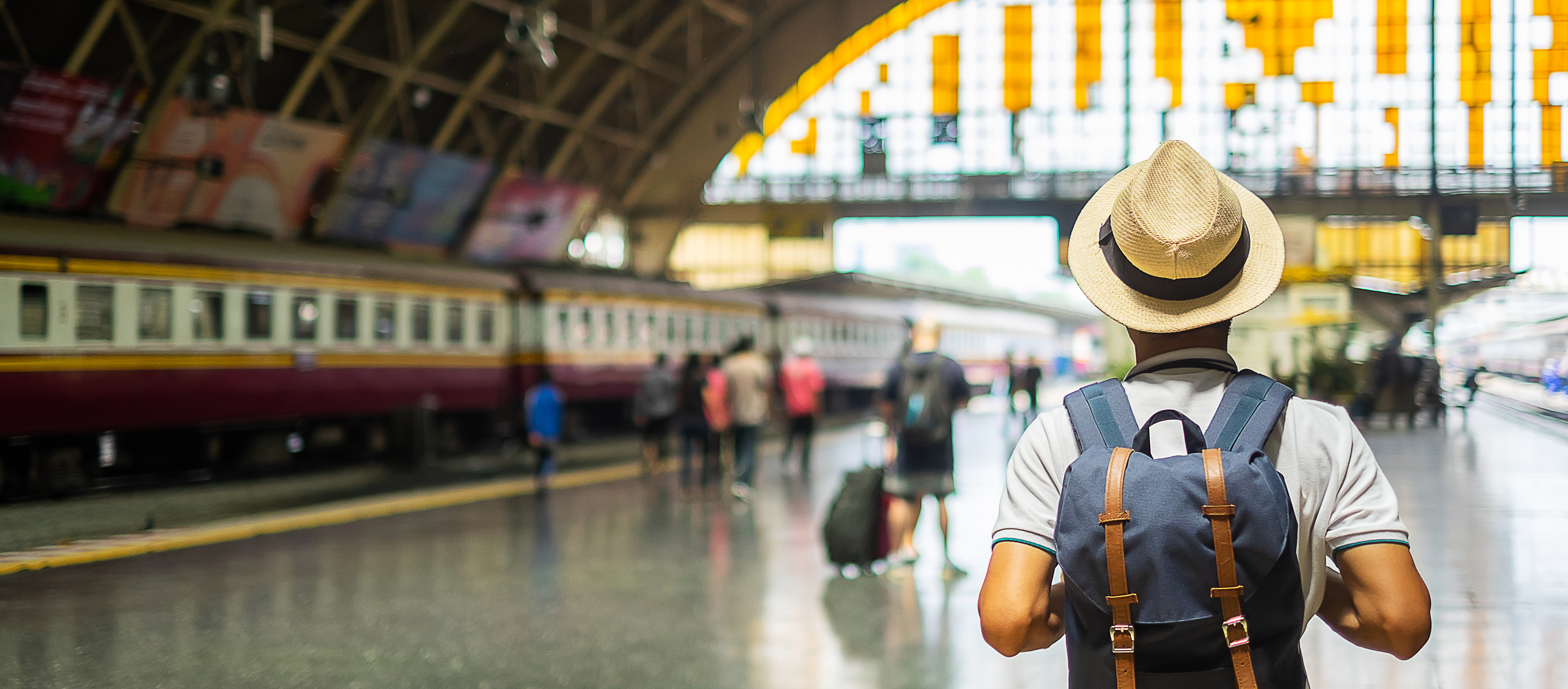 Traveler walking through train station