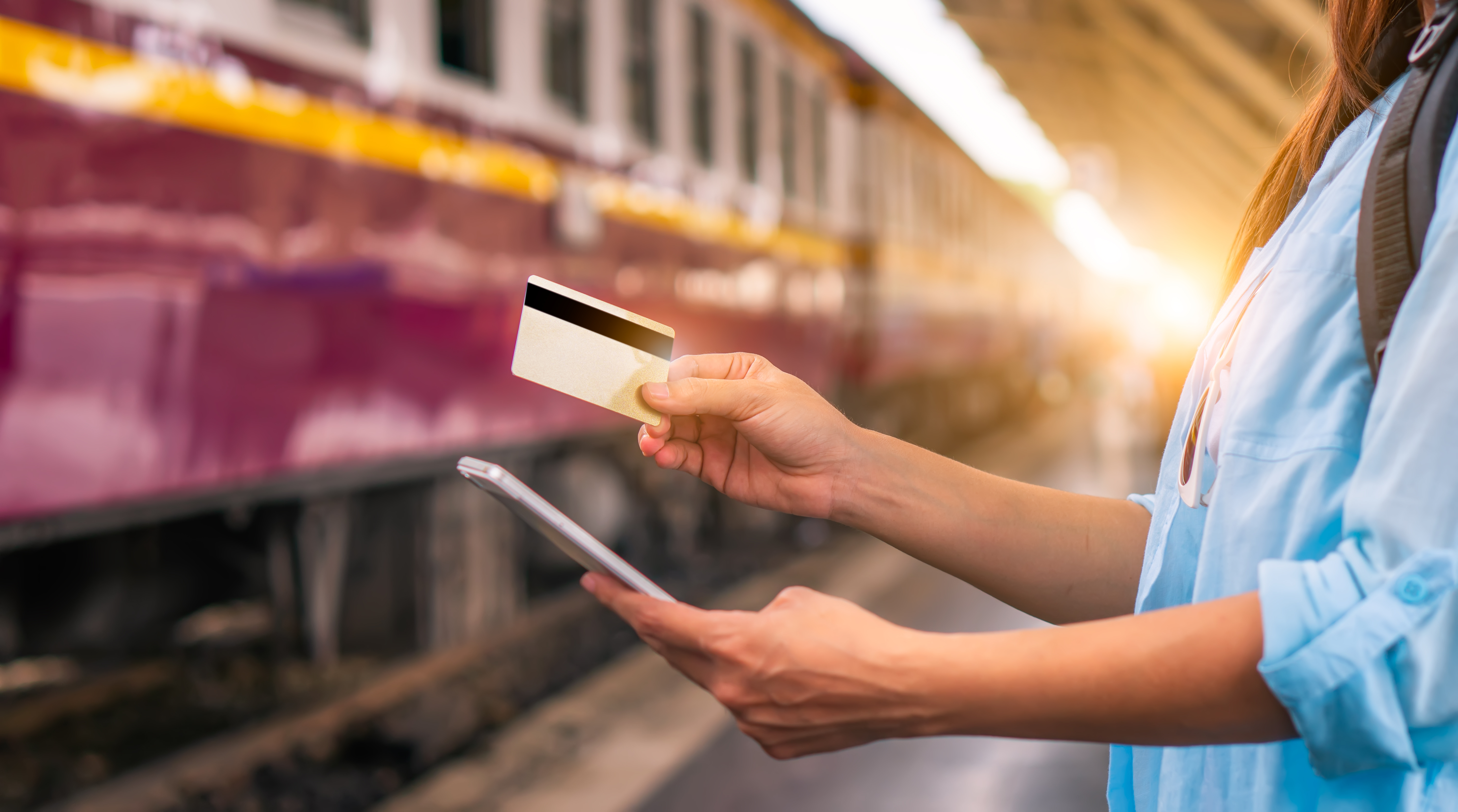 Traveler with credit card at train station