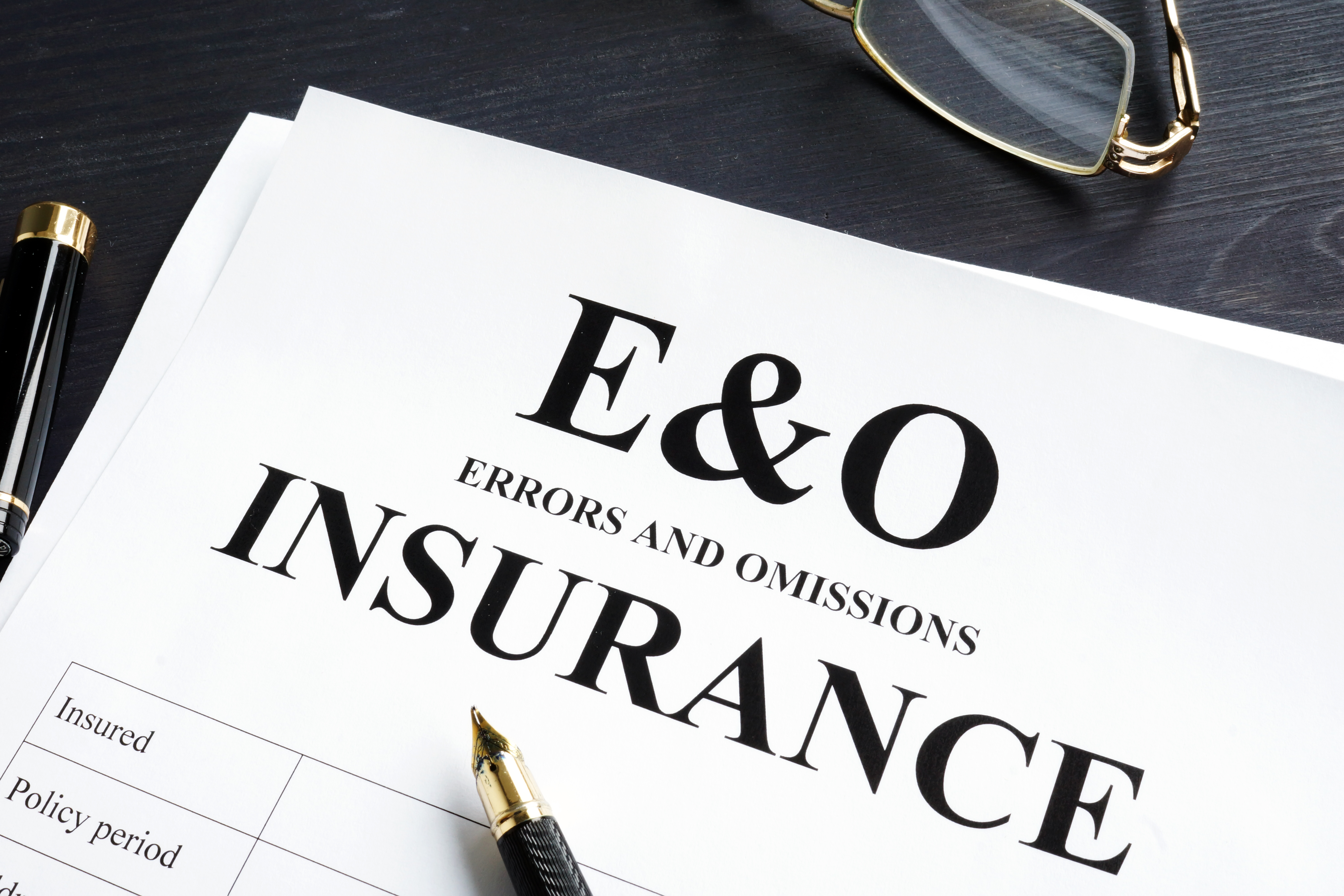 E&O insurance form with pen