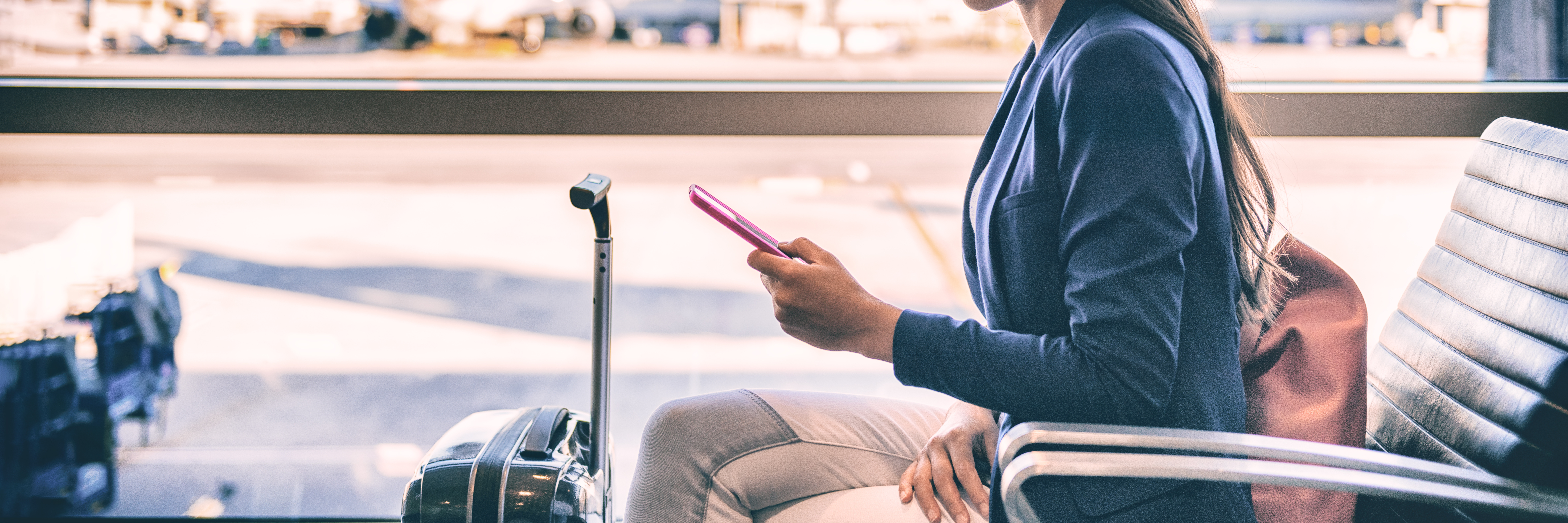 Woman on phone sitting in airport