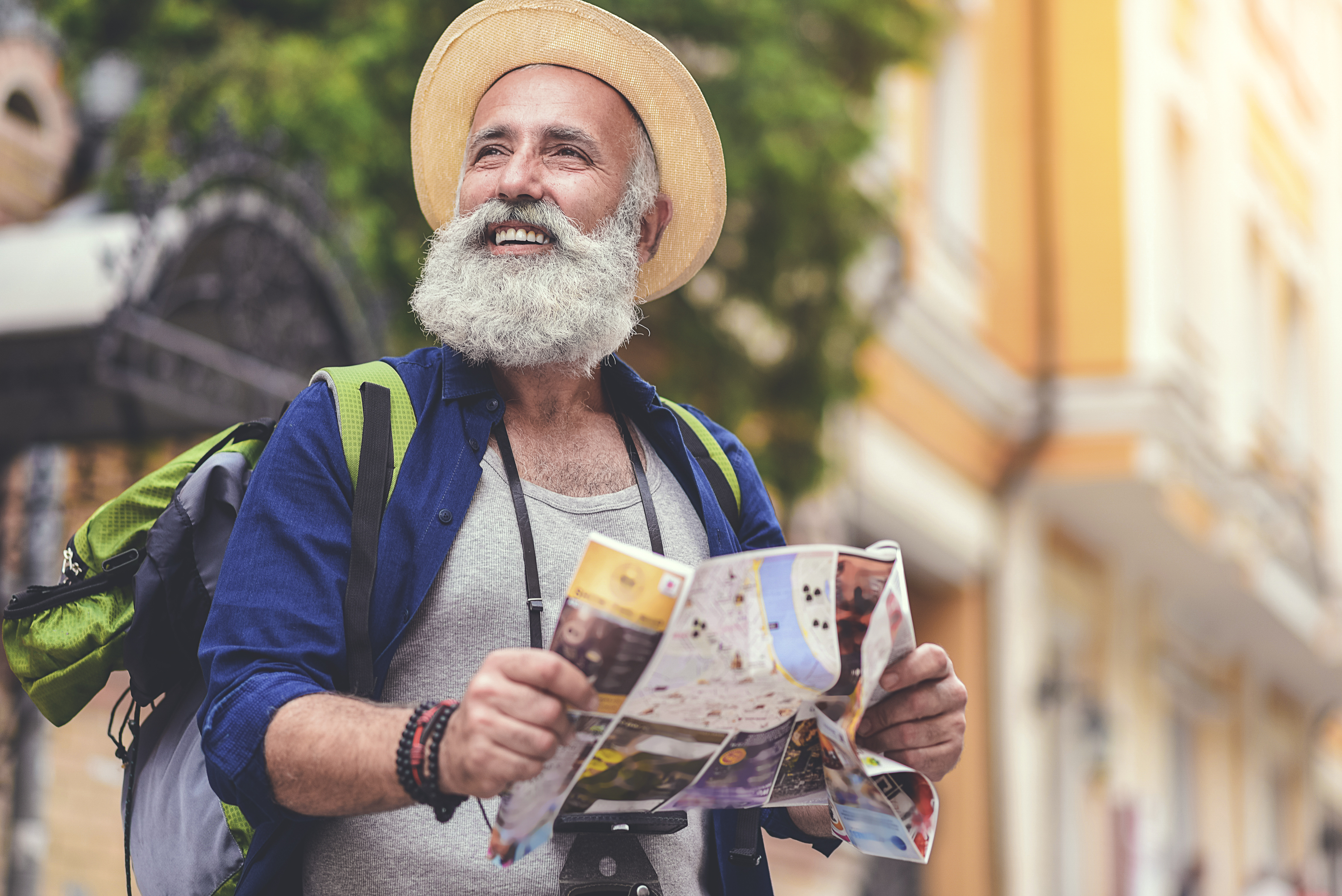 Senior male traveler looking at map