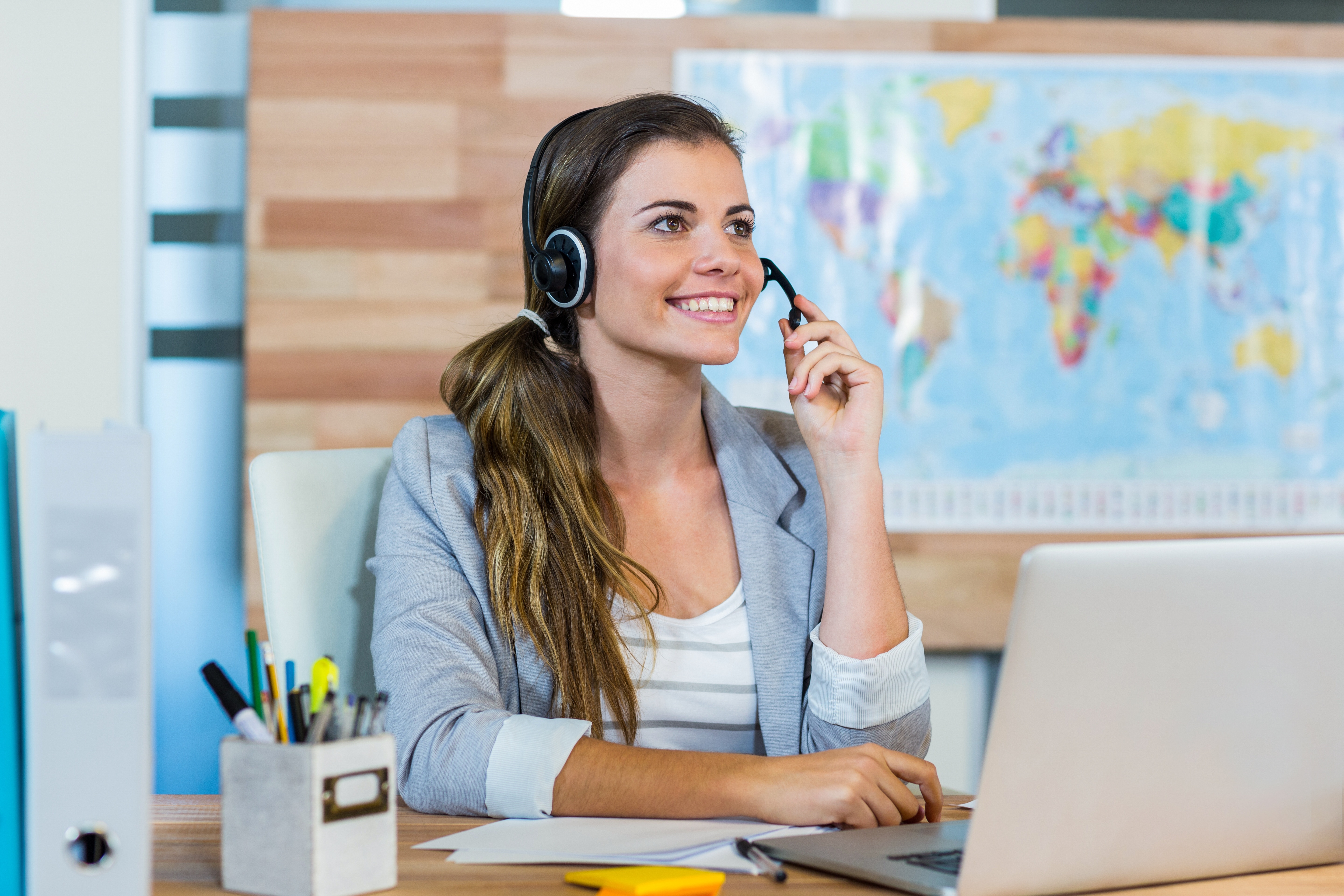 Travel agent talking with headset