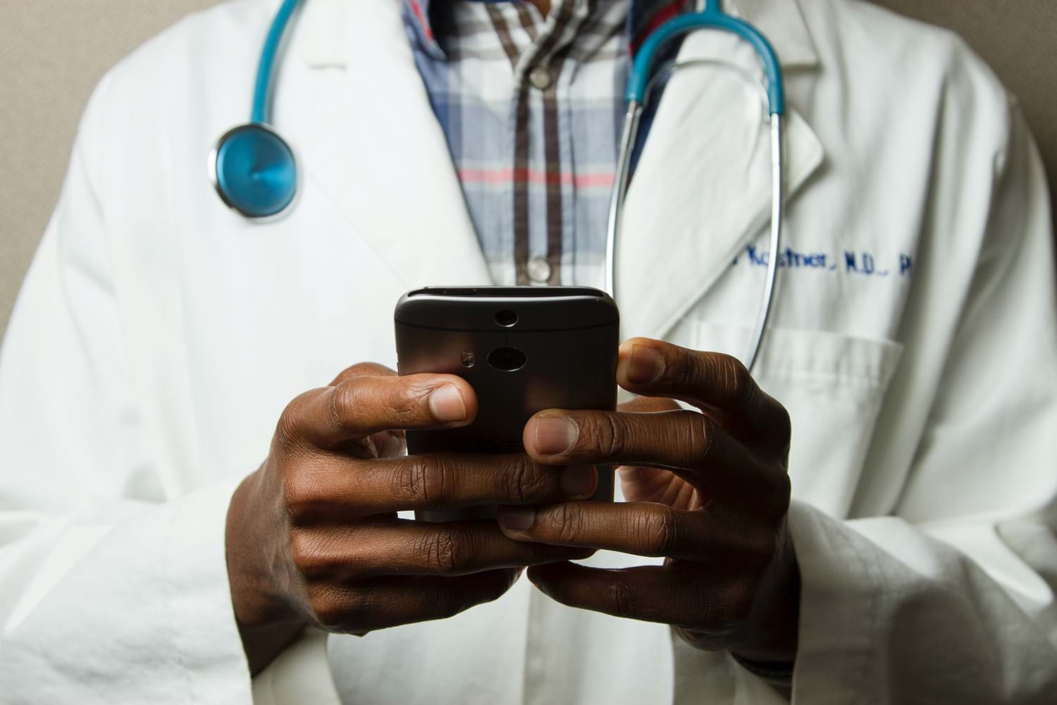 Doctor holding smartphone