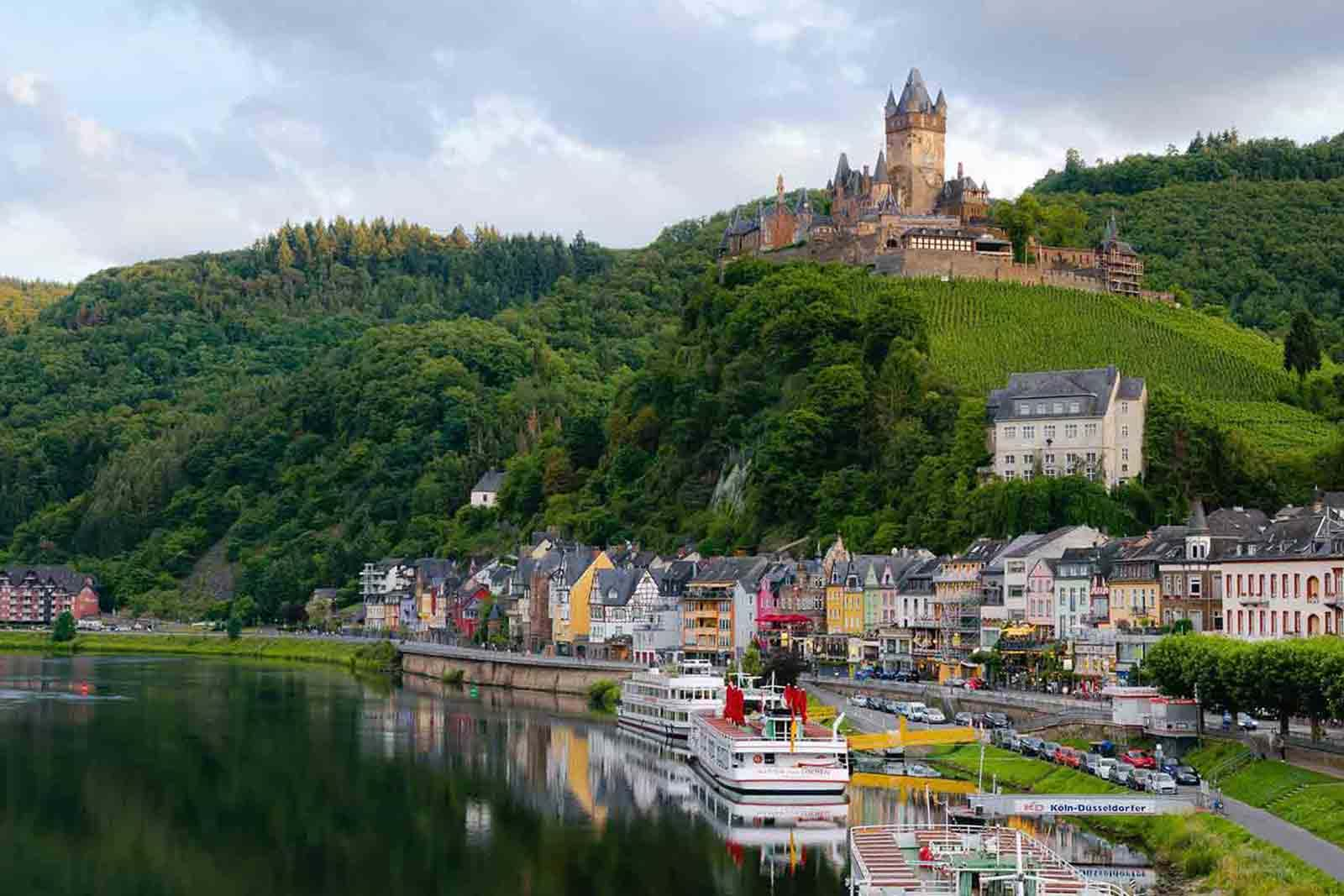 Castle on hill next to village and river