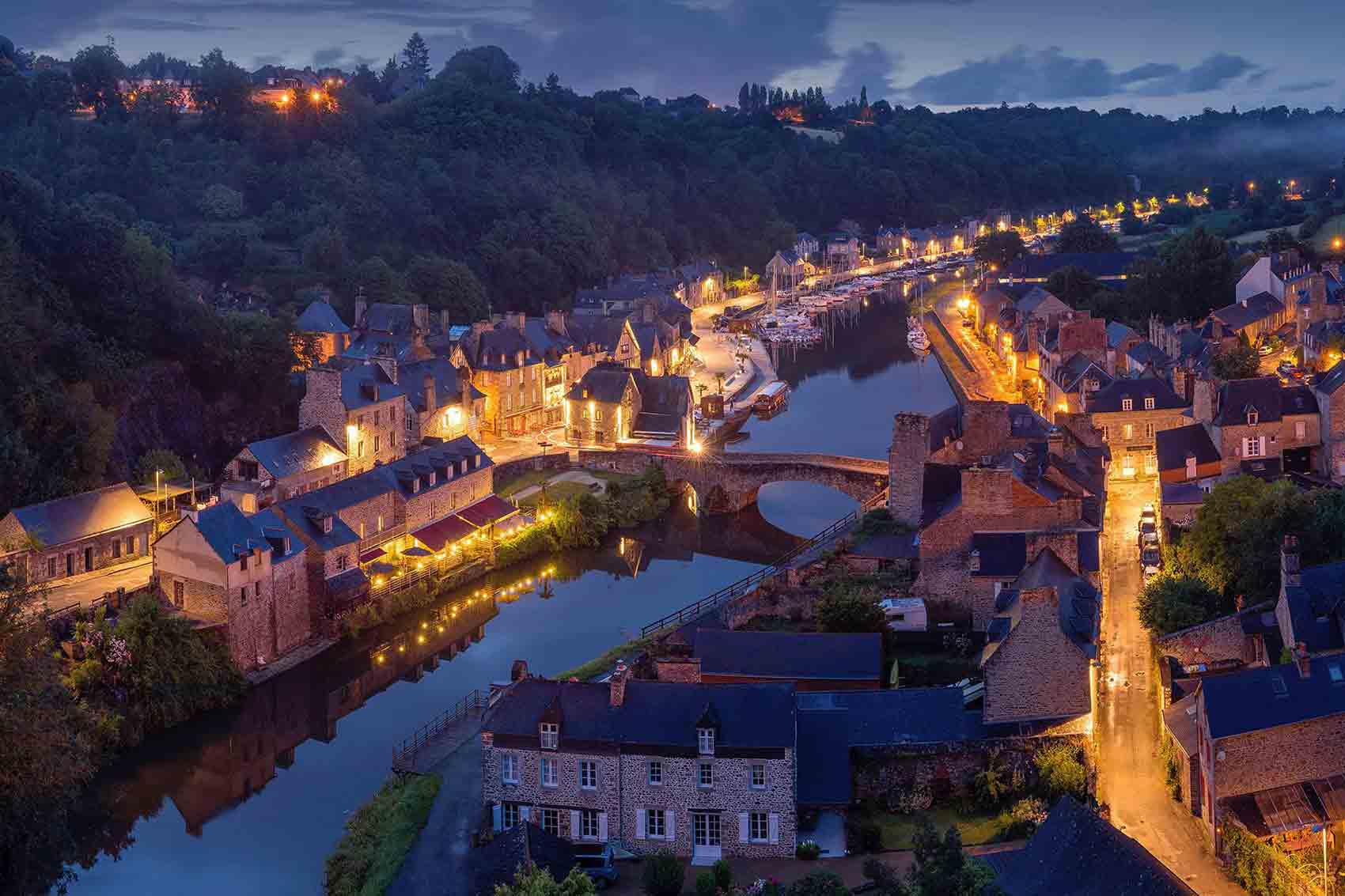 River through a European town at night