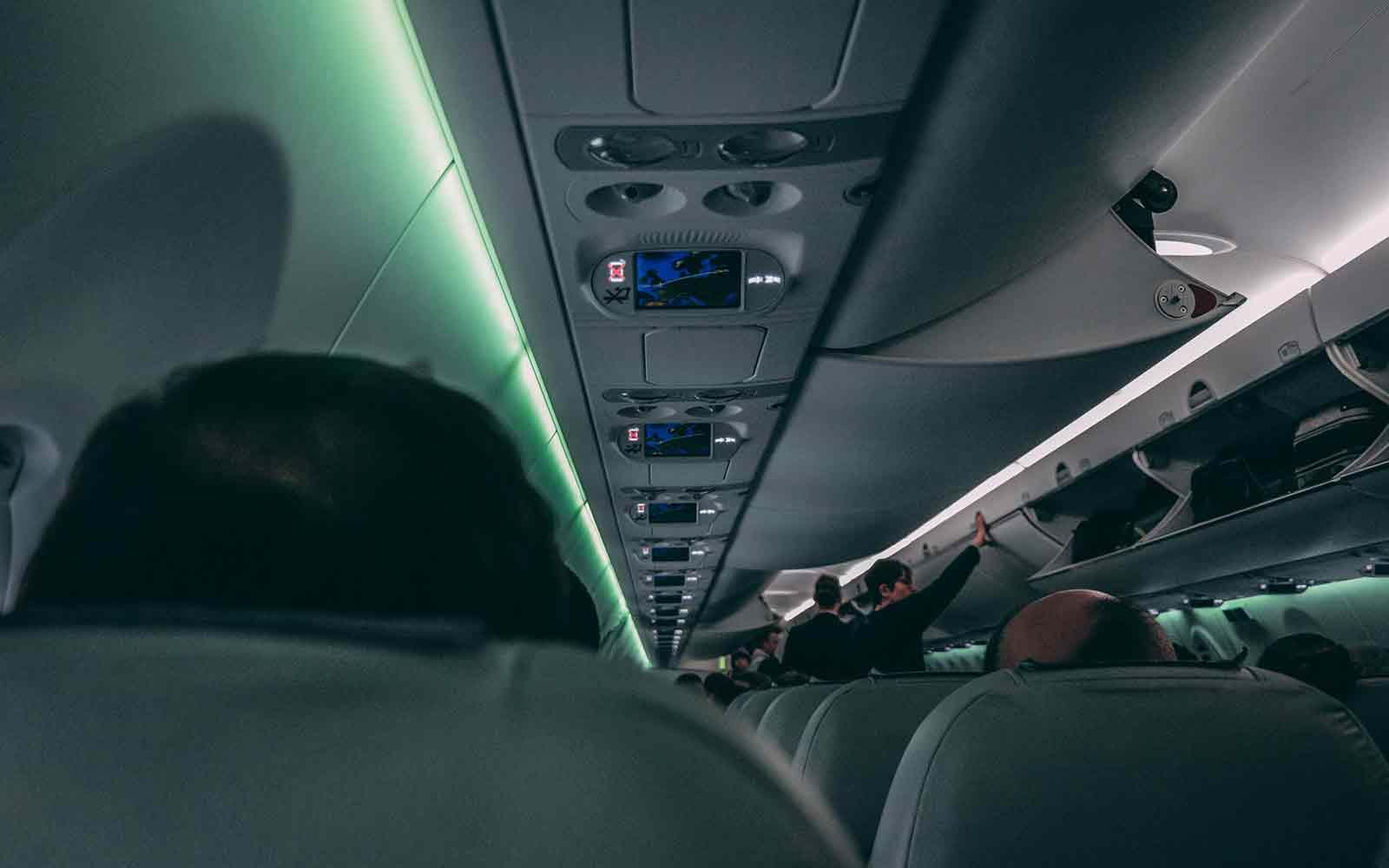 Passengers boarding crowded plane