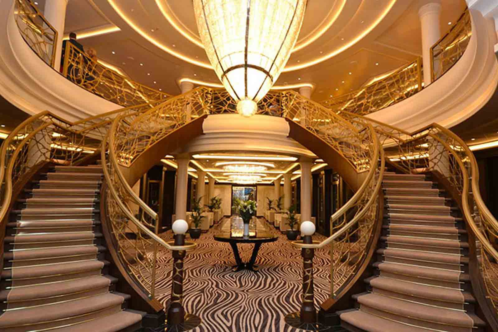 Warm lit interior stairwell of cruise ship