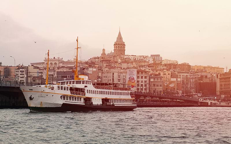 Ferry moving away from city