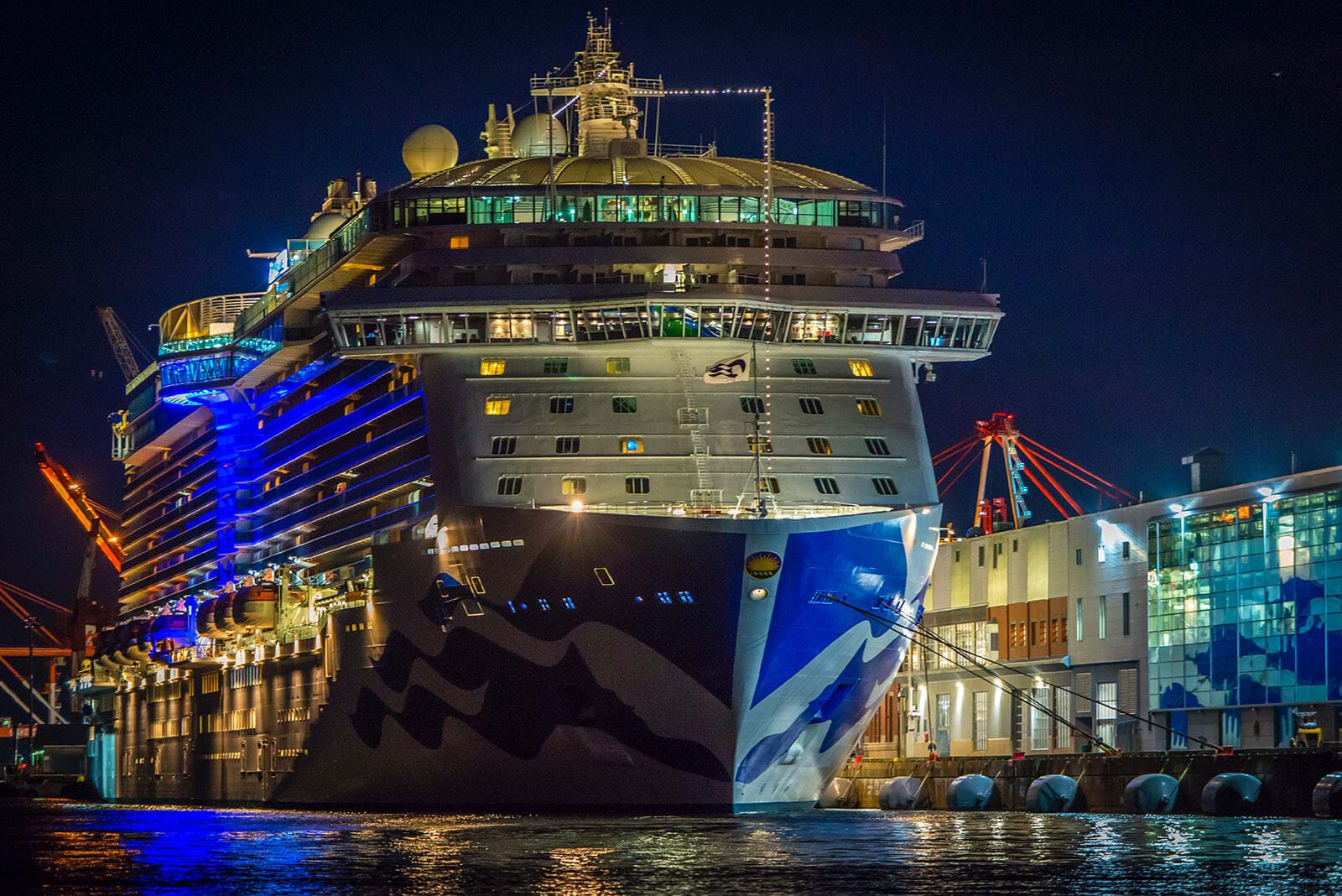 Docked cruise ship lit up at night