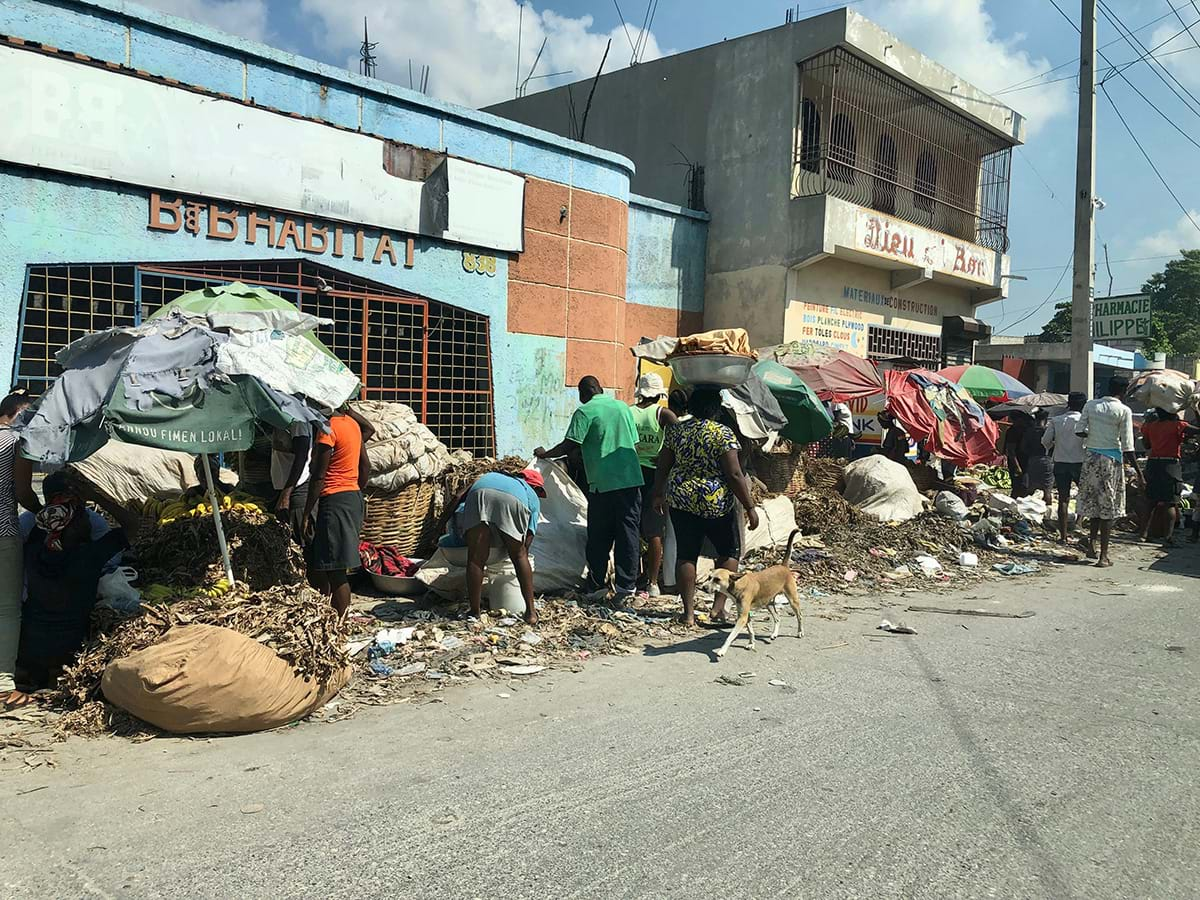 People sorting through debris after storm