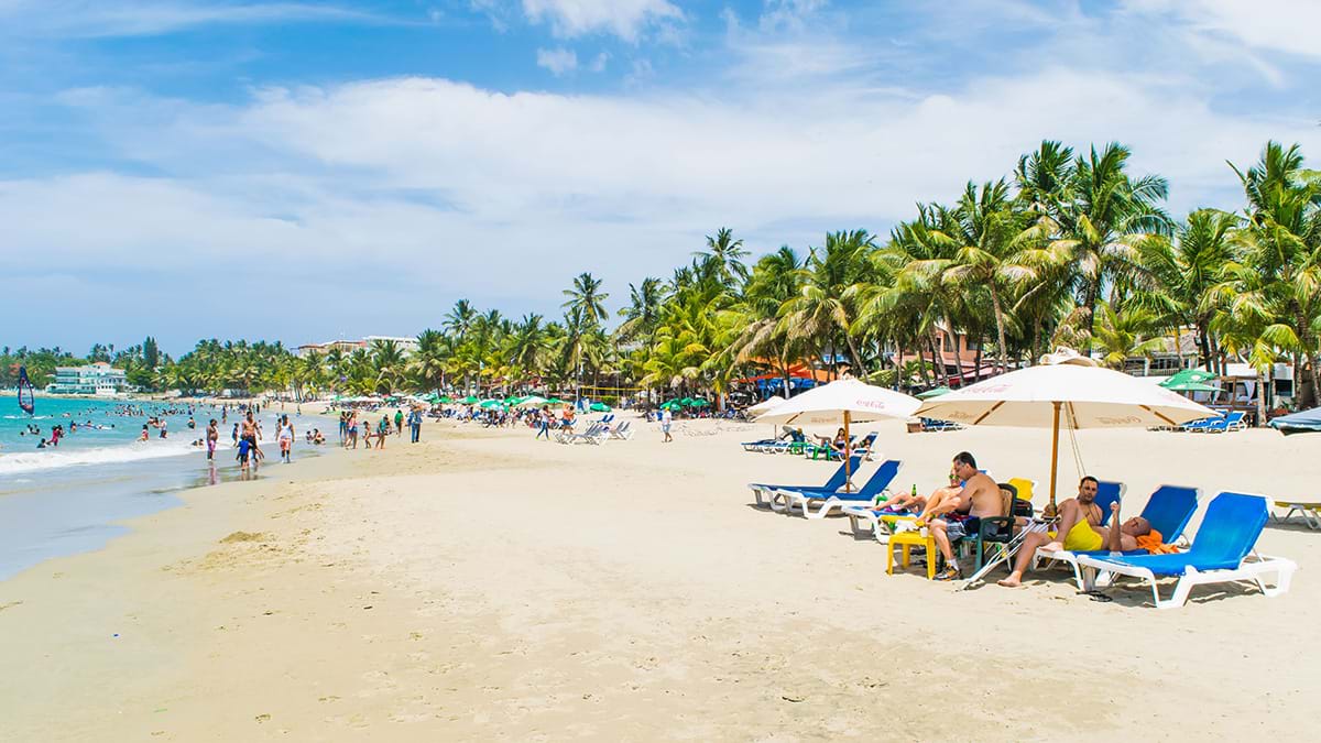 People relaxing on tropical beach