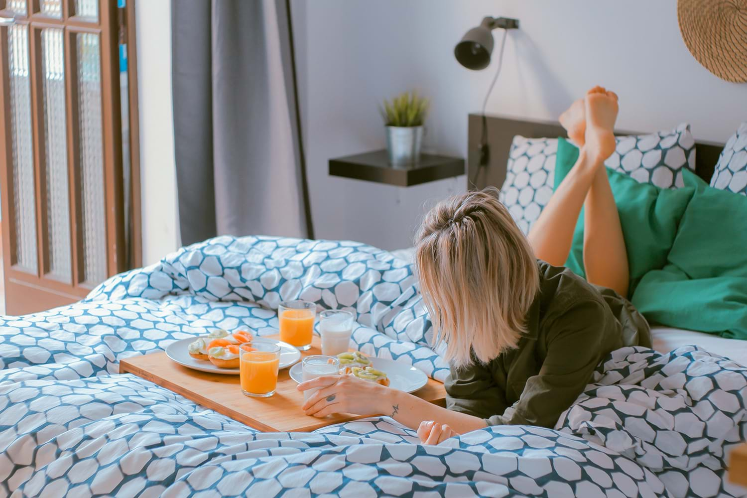 Person eating breakfast on bed