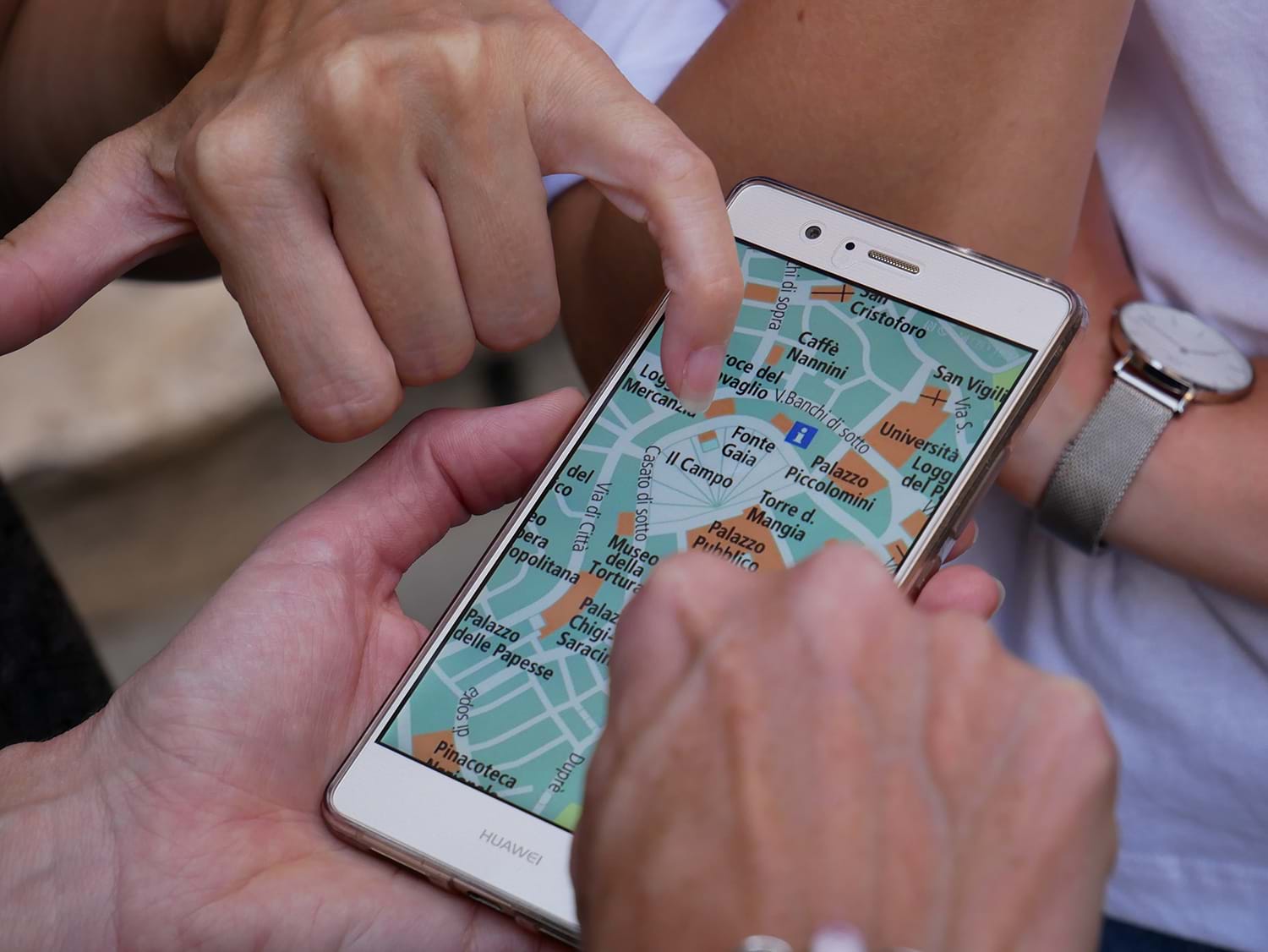 People looking at a map on a phone