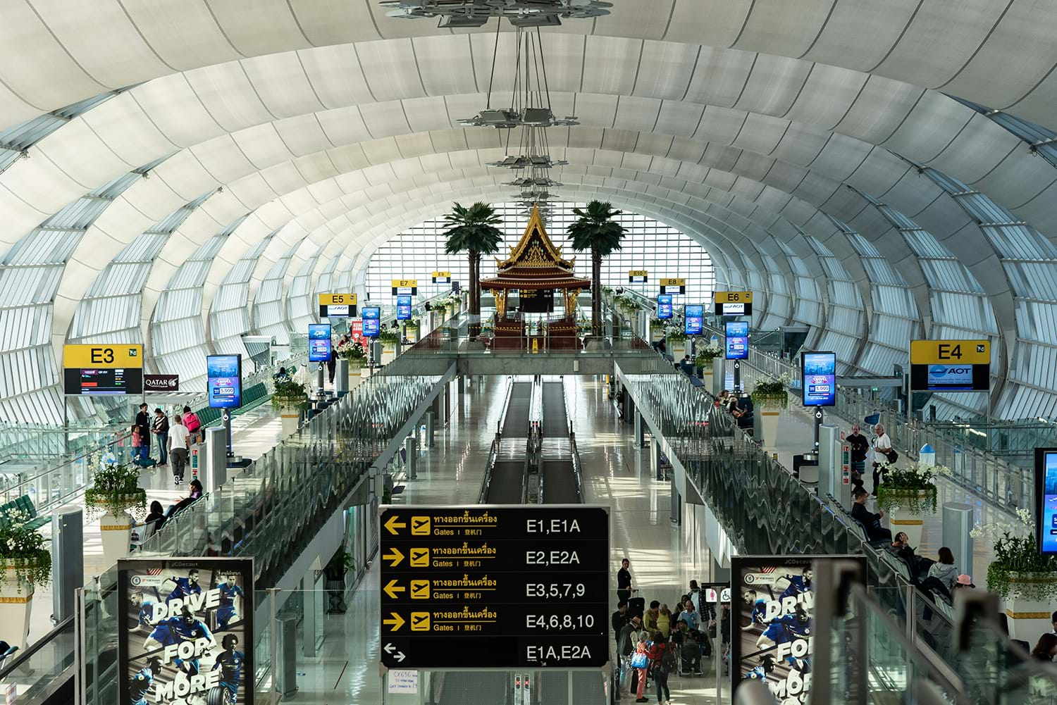 Airport corridor with cylindrical walls and ceiling