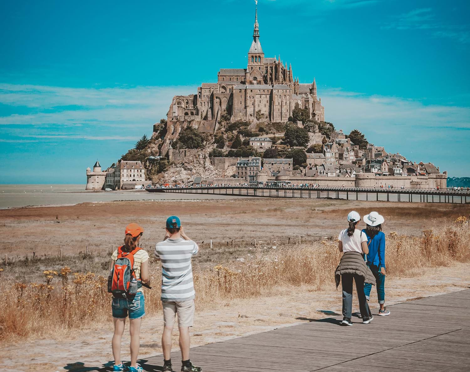 Tourists looking at castle and surrounding town