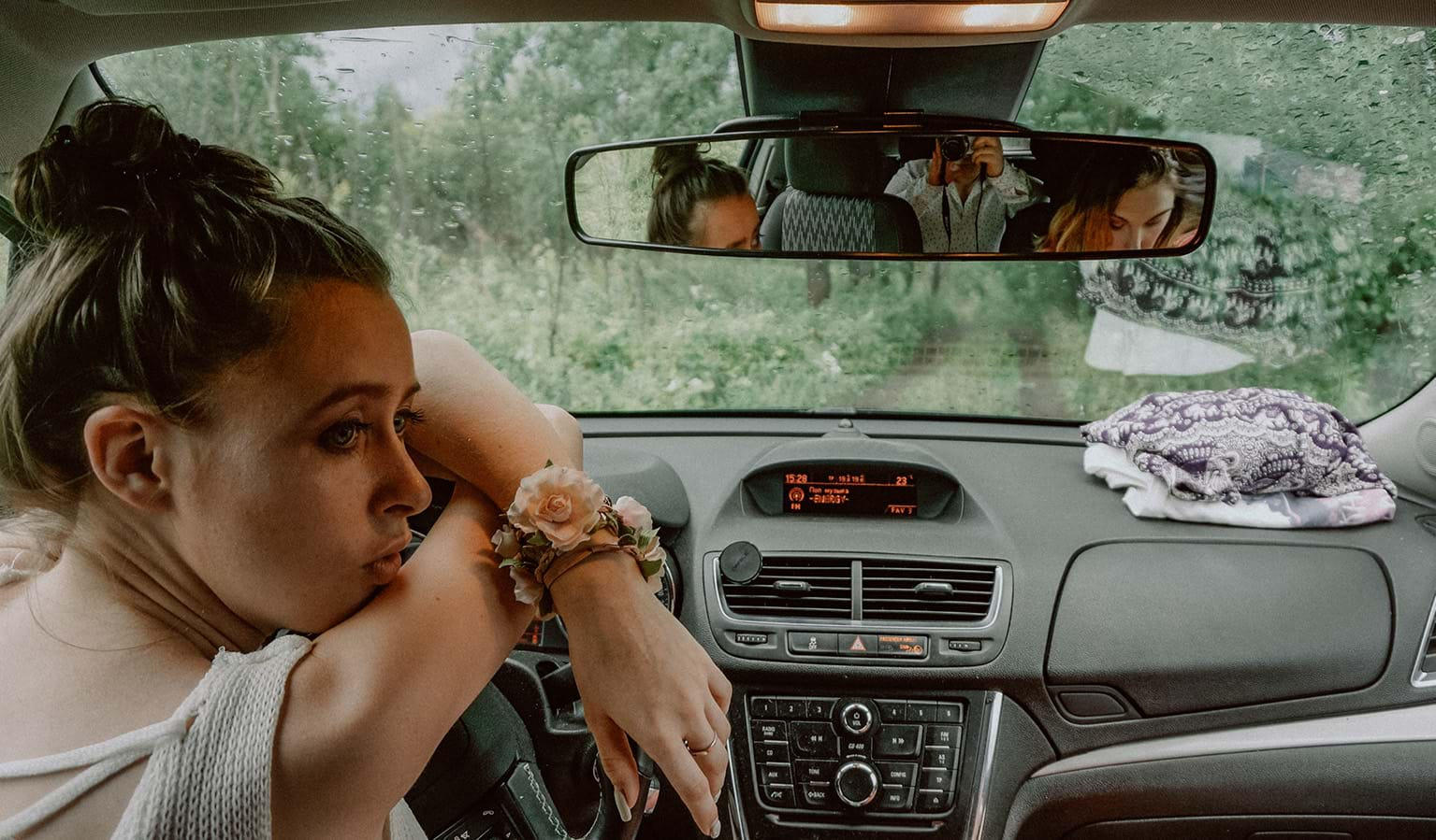 Group of people in a car in the rain