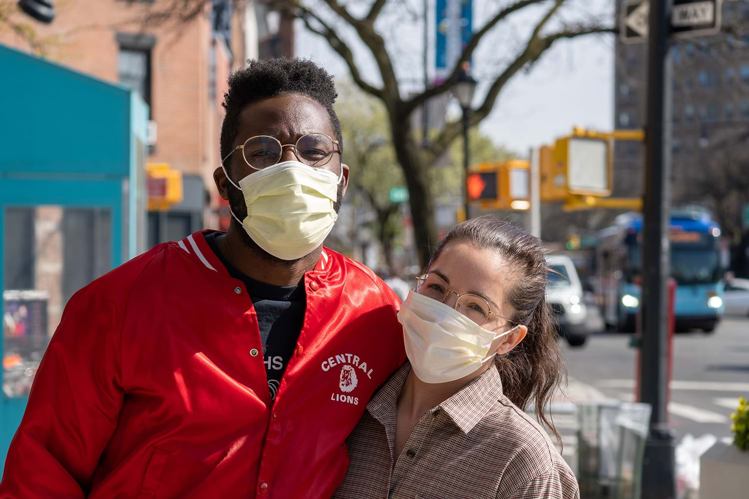 Two people in maskes in city