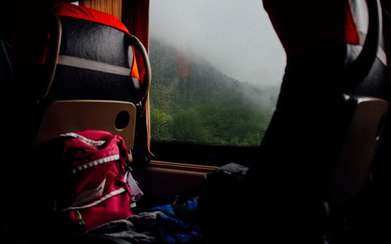 Interior train window with foggy landscape outside