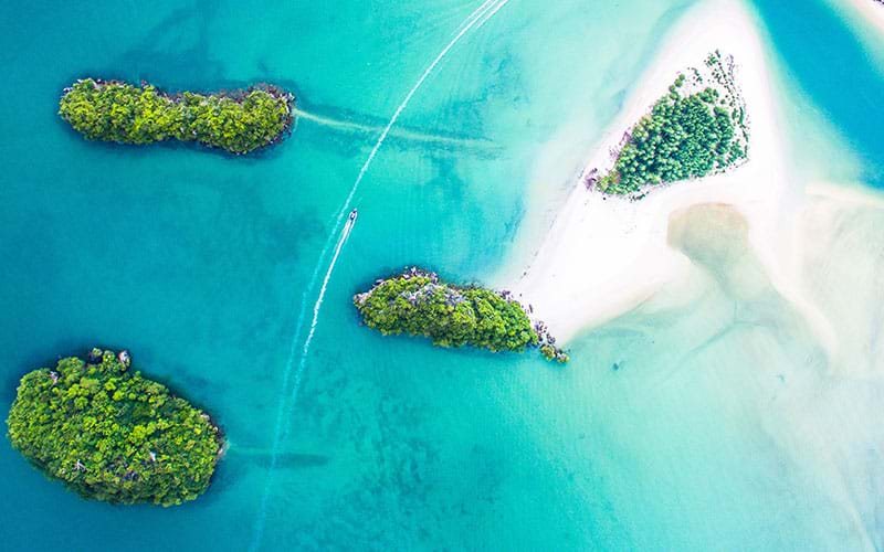 Boats passing through cluster of small islands