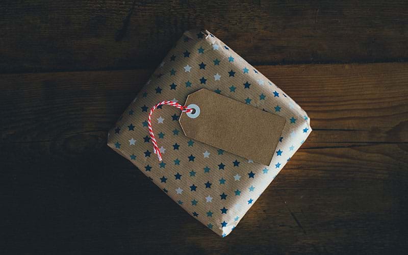 Small gift wrapped in brown wrapping paper