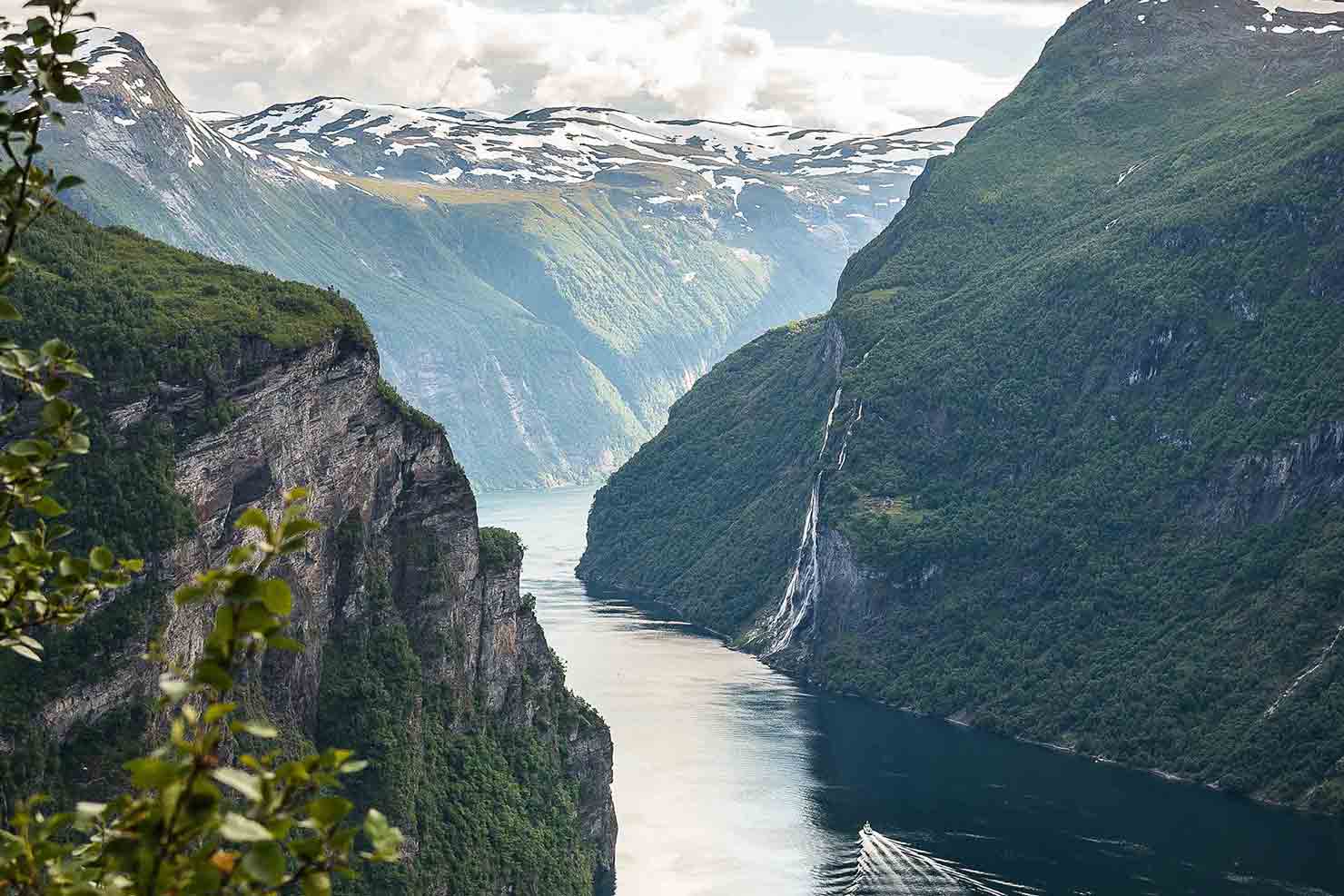 River cutting through grass covered mountains