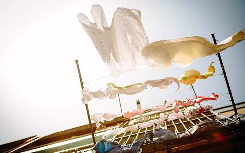 Laundry hanging outside from second story