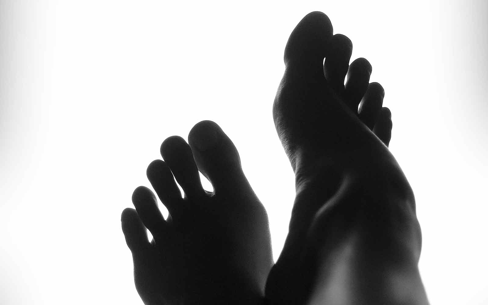 Silhouette of pair of feet