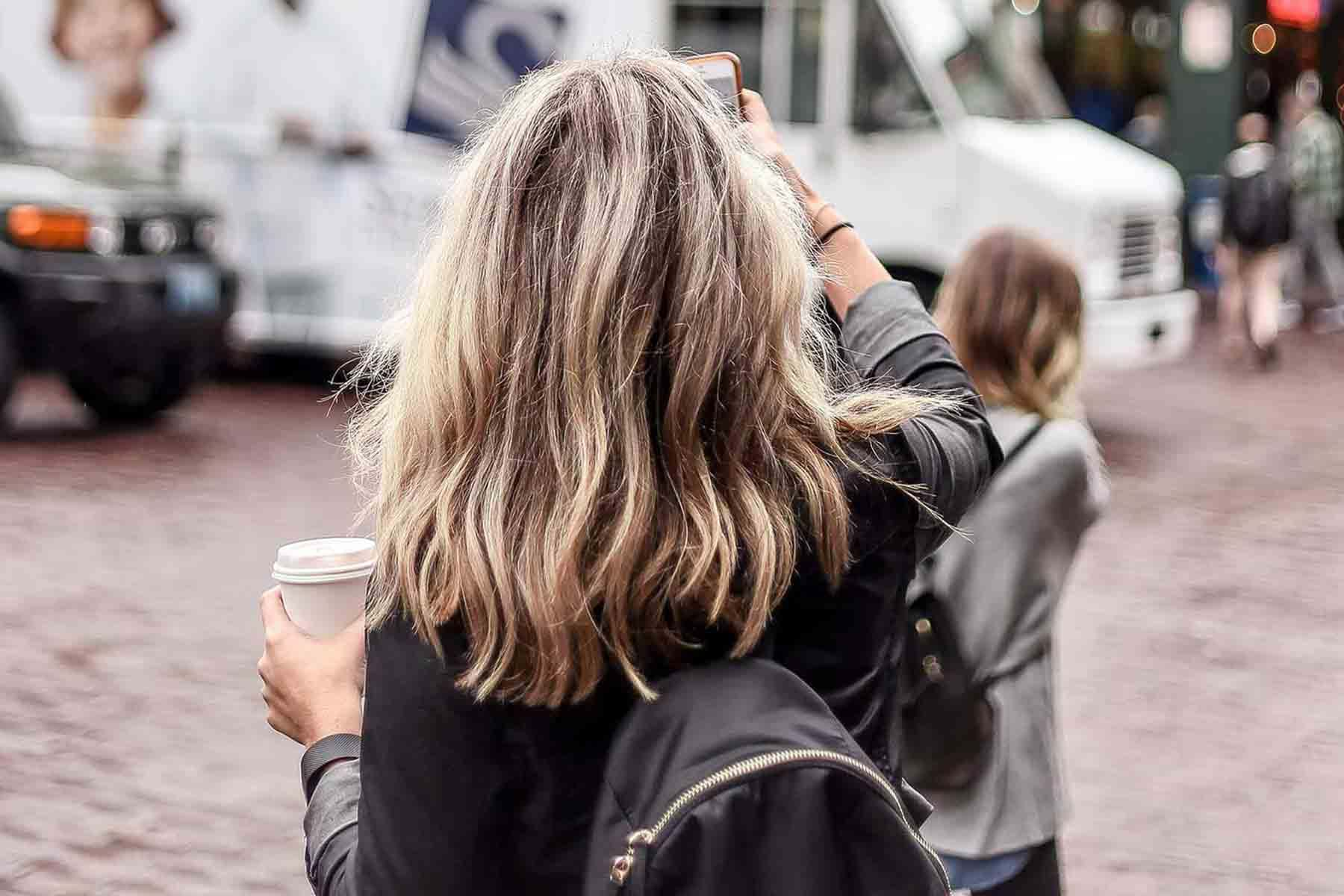 Woman taking picture with her phone