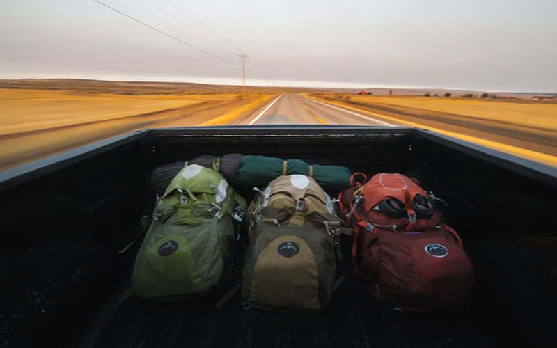 Bags in back of pickup truck on the road