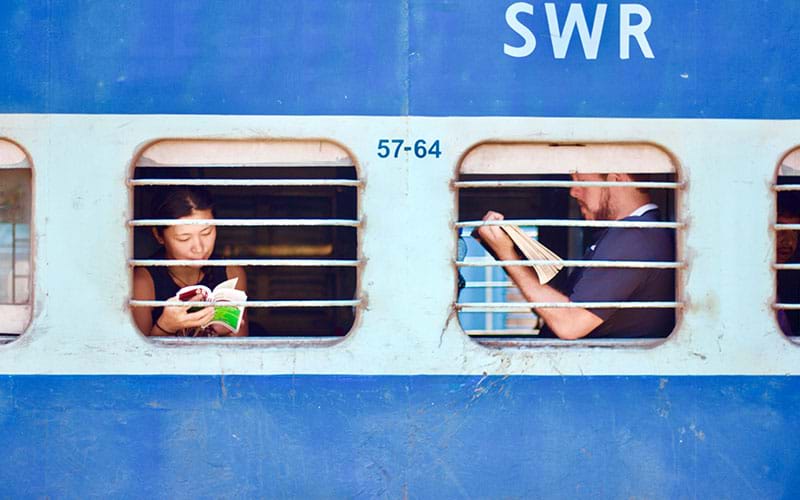 Passengers reading in train windows