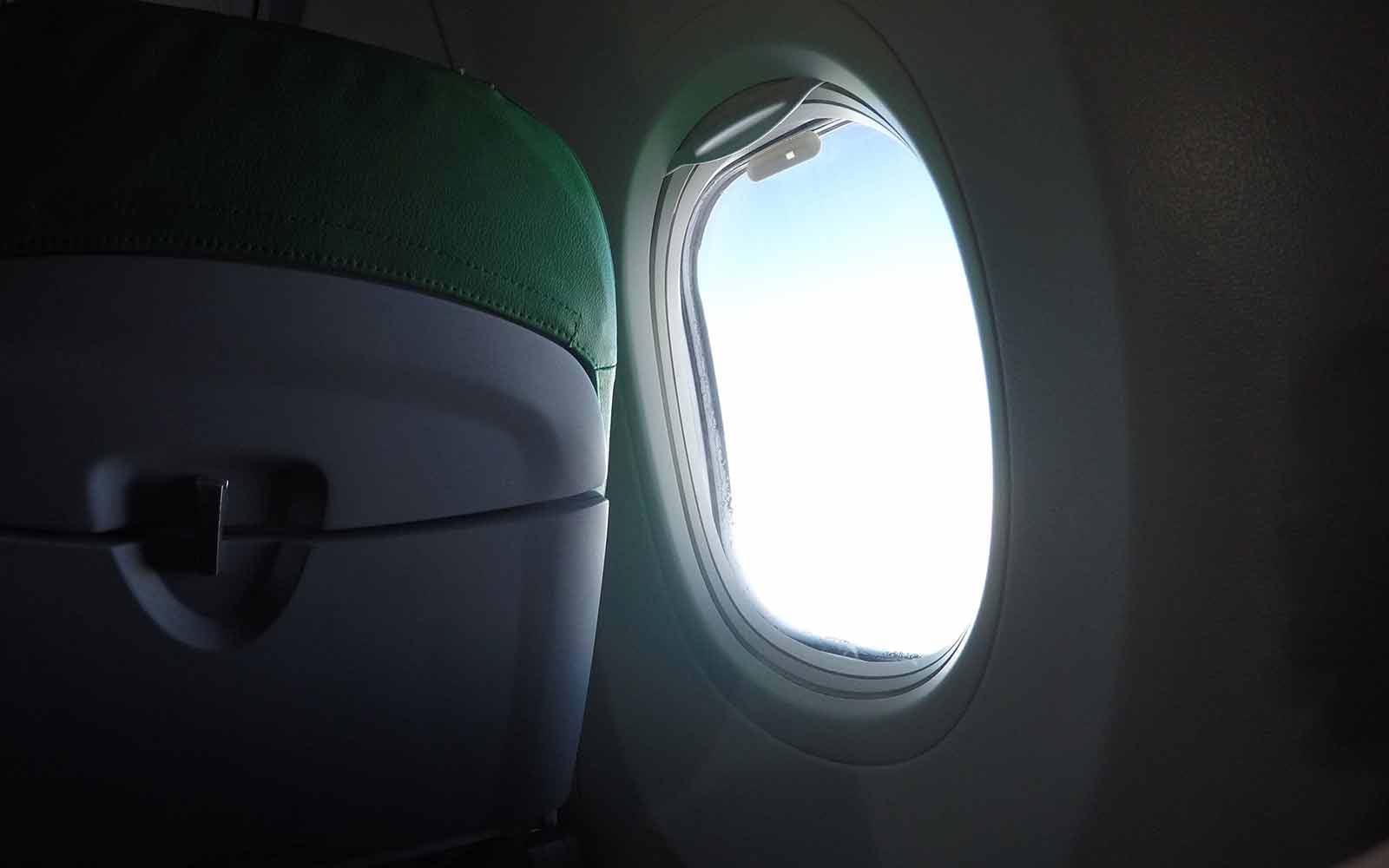 Dark plane interior with light coming through window