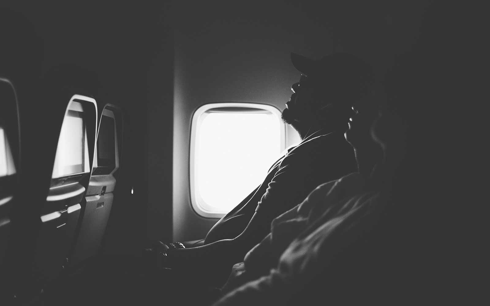 Sleeping passengers in dark plane