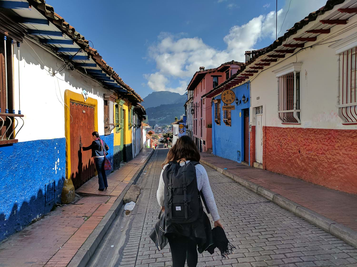 Tourist walking down narrow street in Columbia