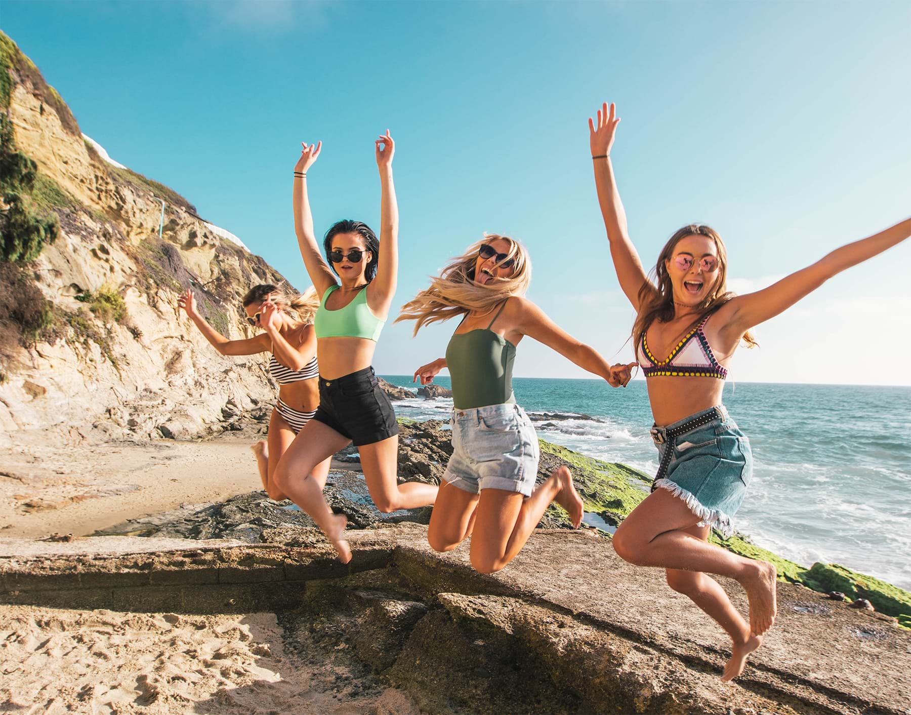 Young friends jumping for a photo