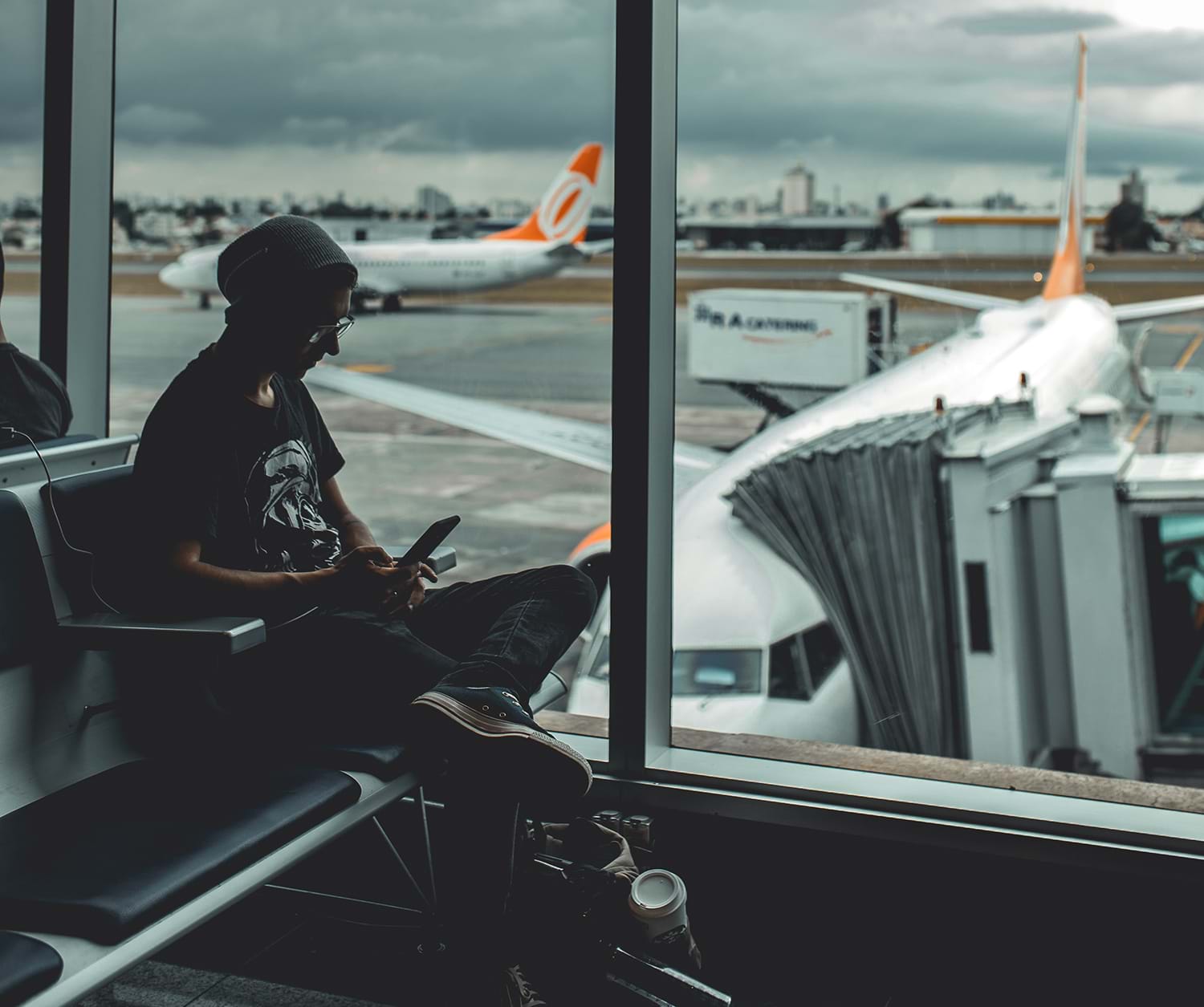Person sitting waiting to board their flight