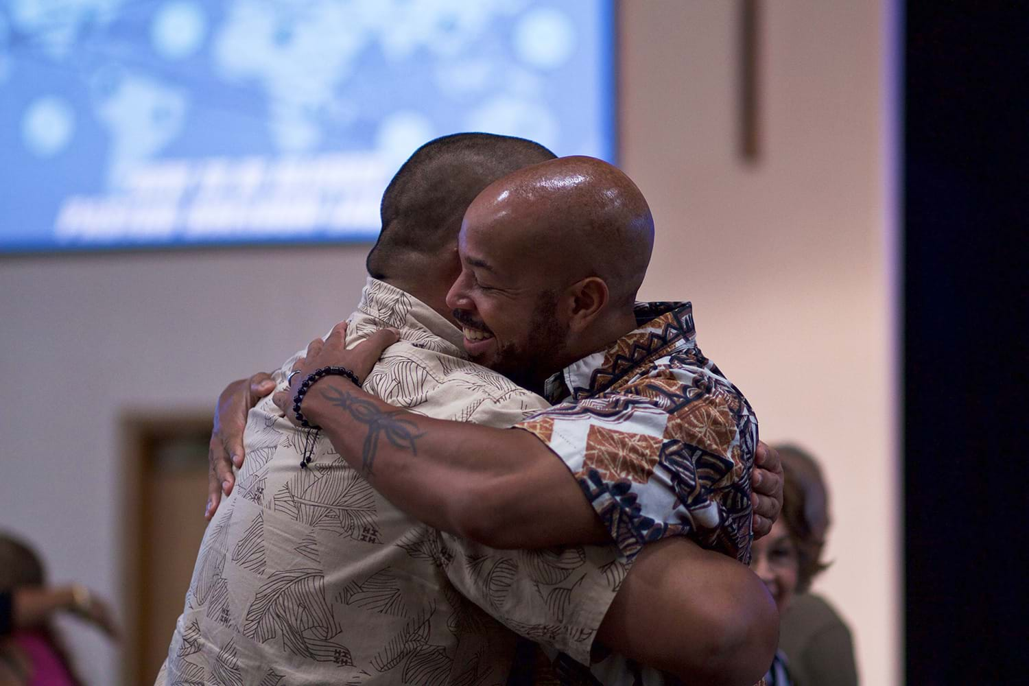 Two men hugging