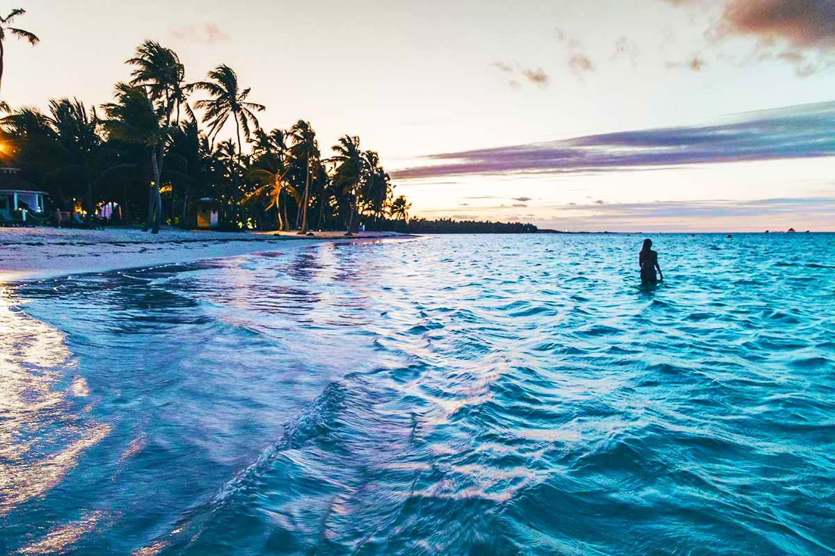 Purple and blue waters around tropical beach