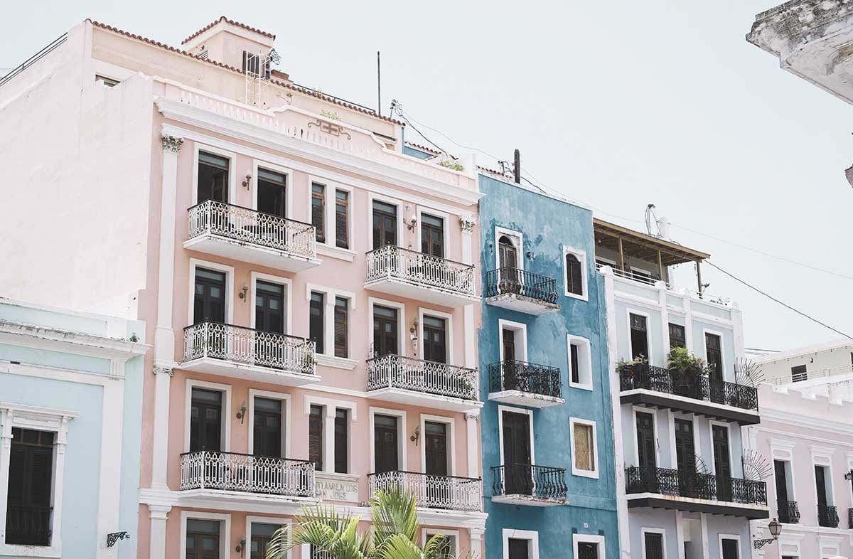 Pink and blue buildings with balconies