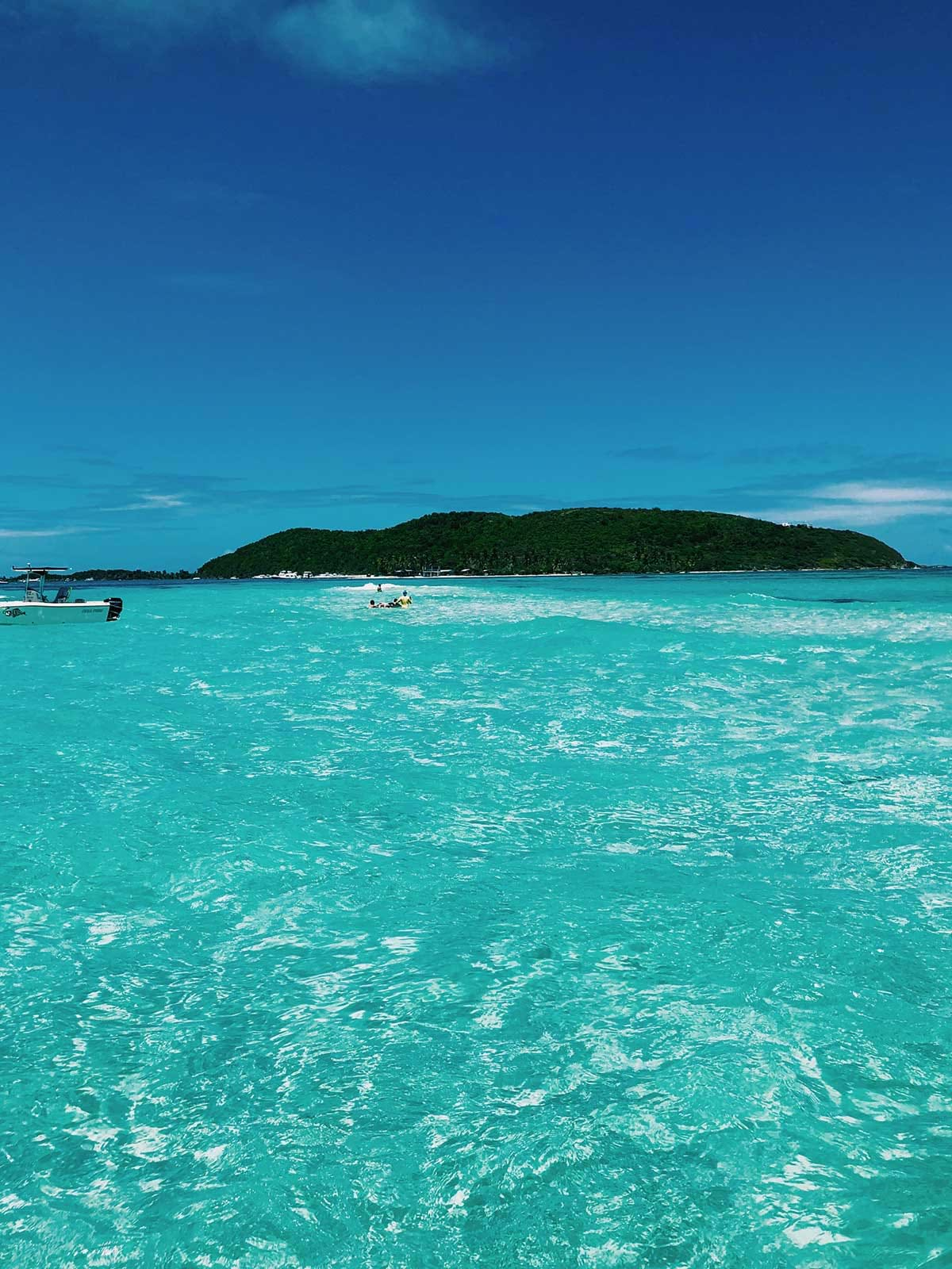 People boating on clear waters