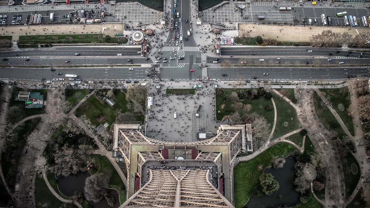 Aerial view of Eiffel Tower and crowds of tourists at it's base