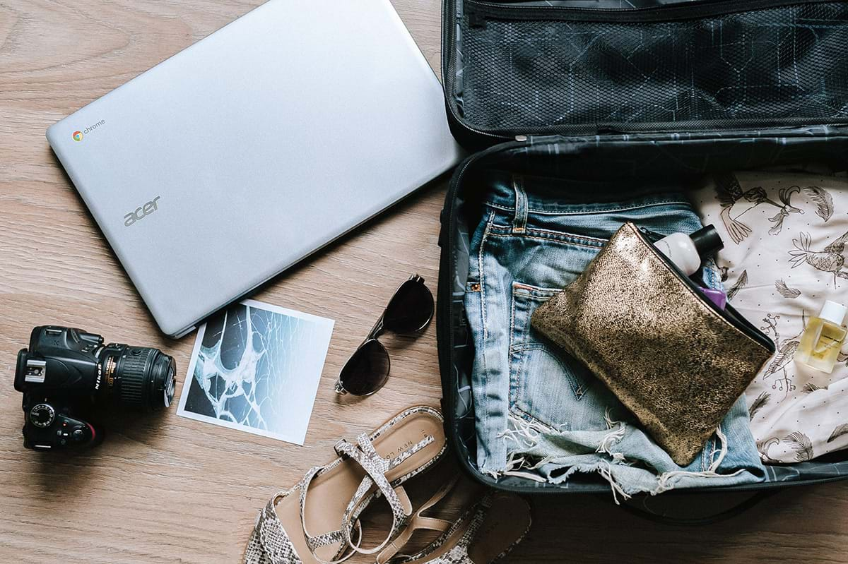 Partially packed suitcase with essentials sitting out