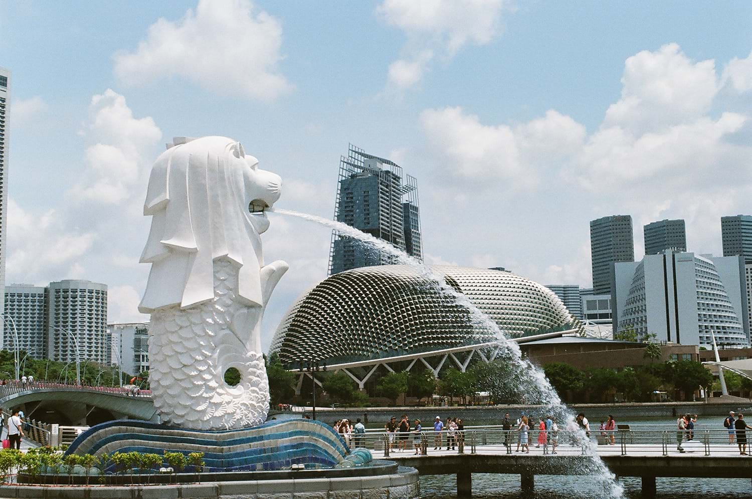 Lion statue spitting water into river