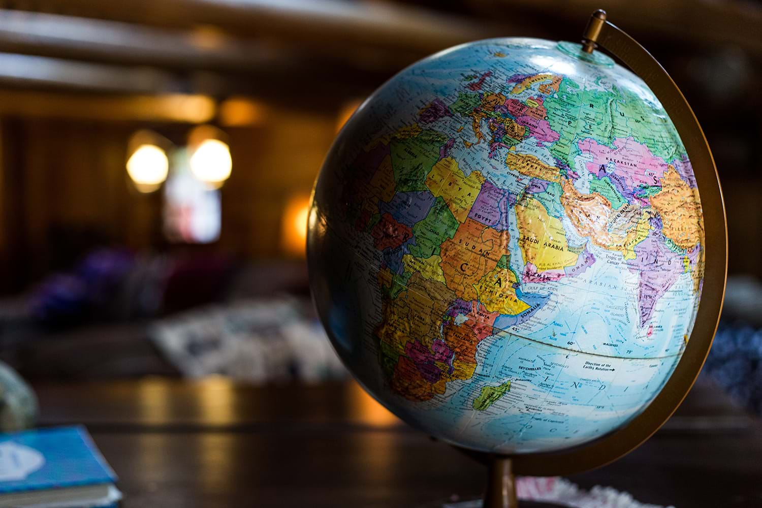 Globe sitting on table in dim room