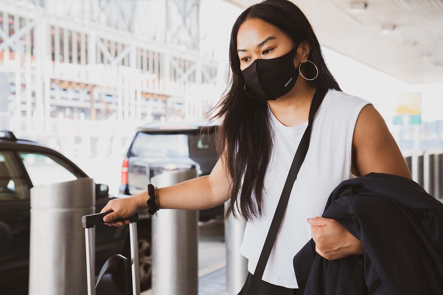 Woman in facemask leaving airport