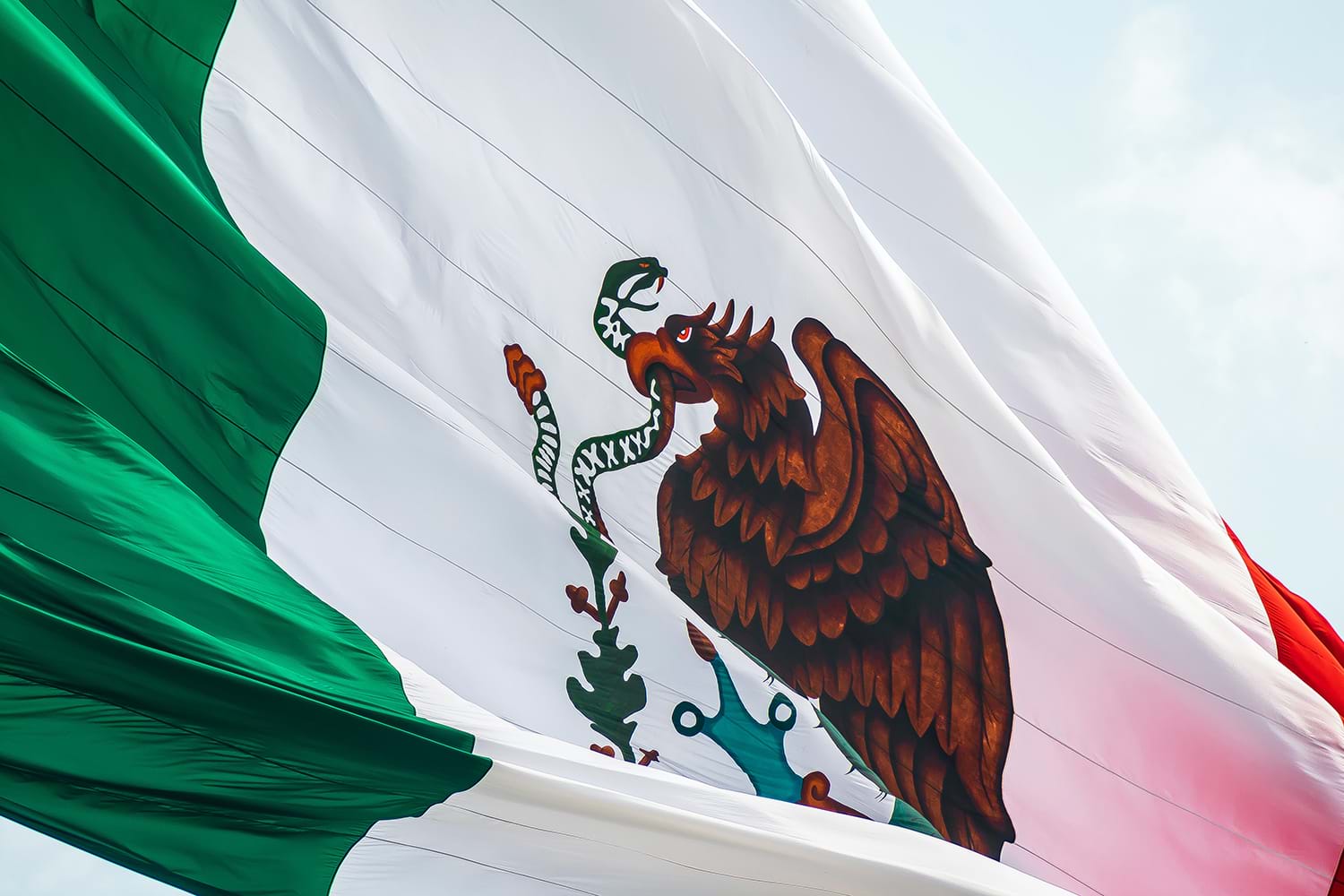 Mexican flag blowing in wind
