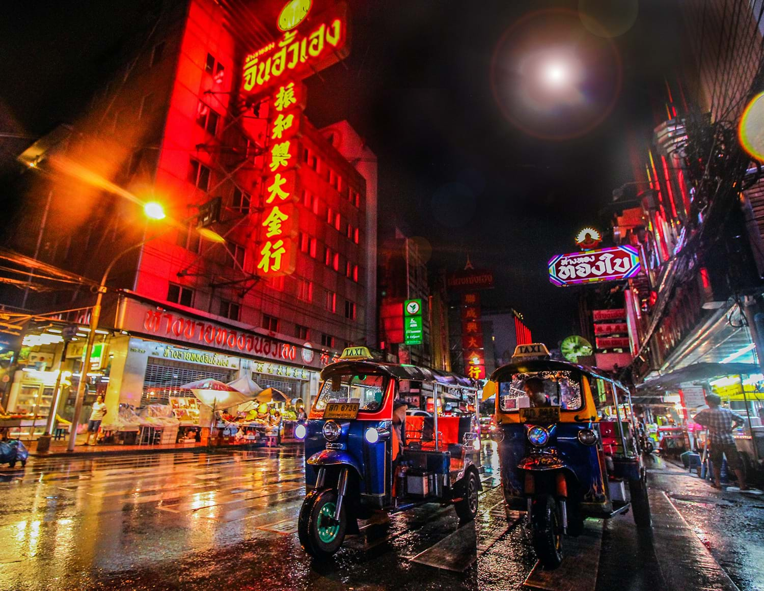 Lit city street at night