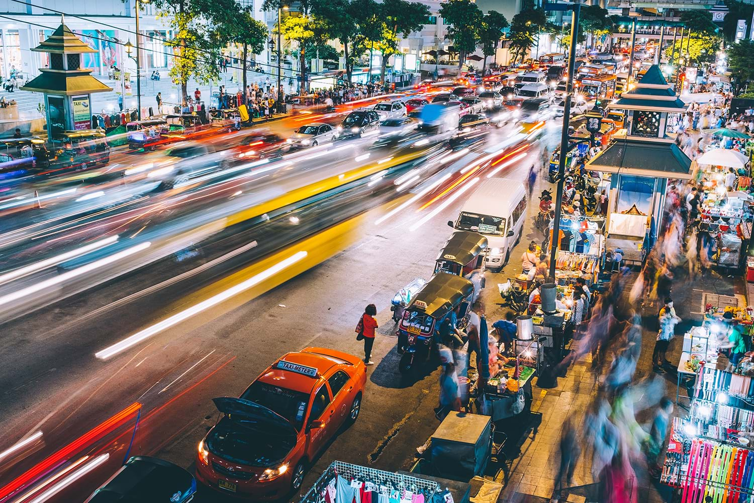 Blurred cars speeding by on busy street